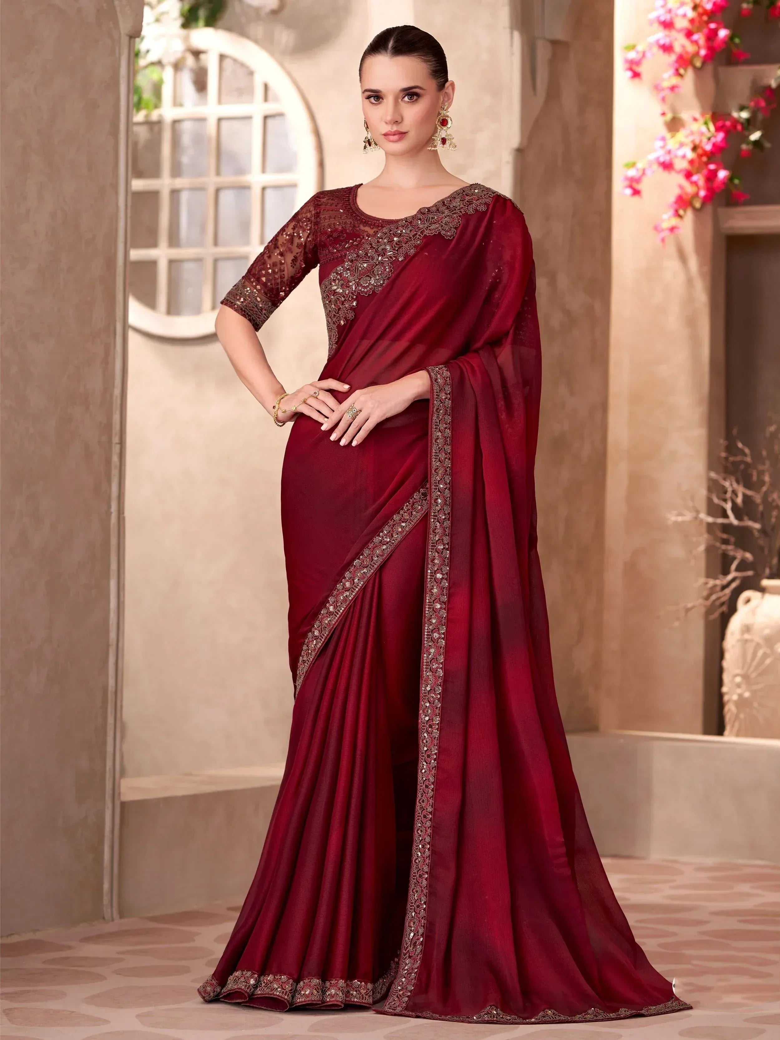 Elegant maroon saree with gold embroidery, perfect for Indian ethnic occasions and festive wear.