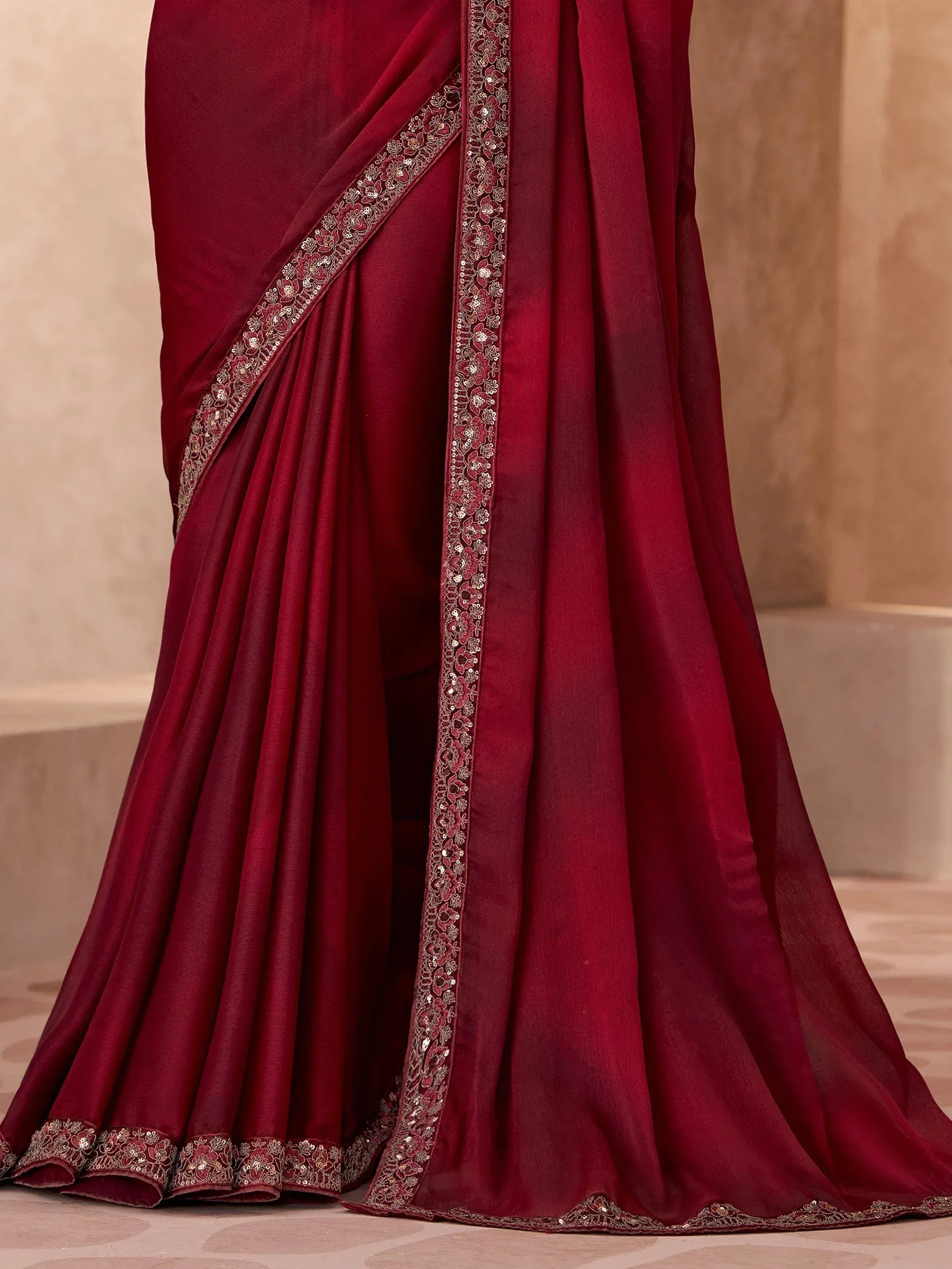 Rich maroon saree with floral embroidery and sequin border, elegant Indian ethnic wear