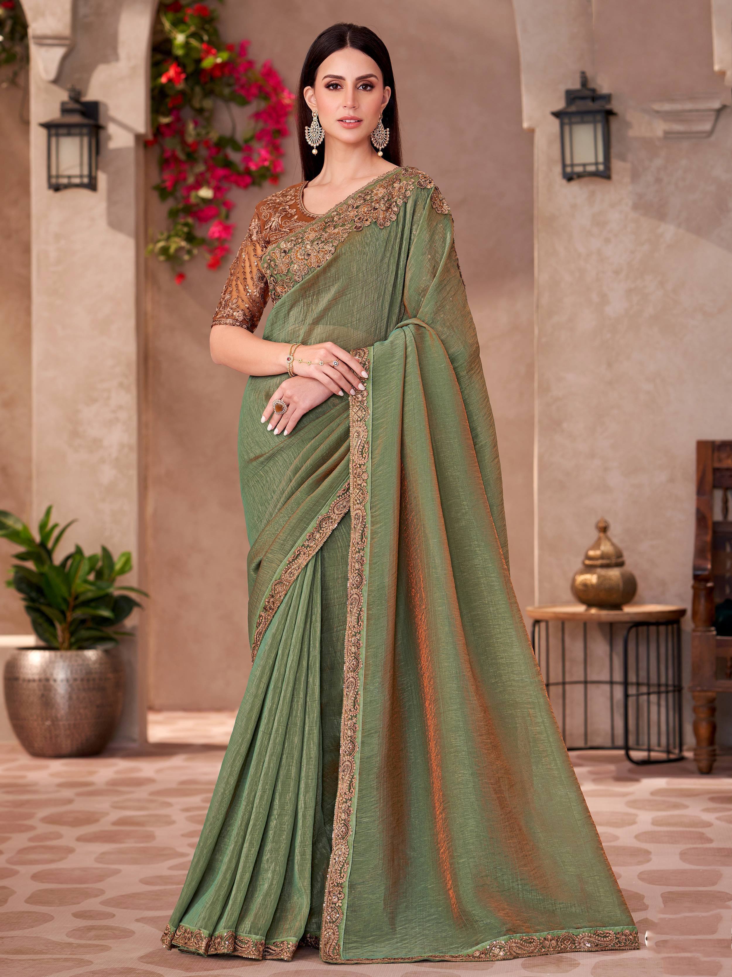 Elegant green saree with gold embroidery, perfect for Indian ethnic occasions and festive wear.
