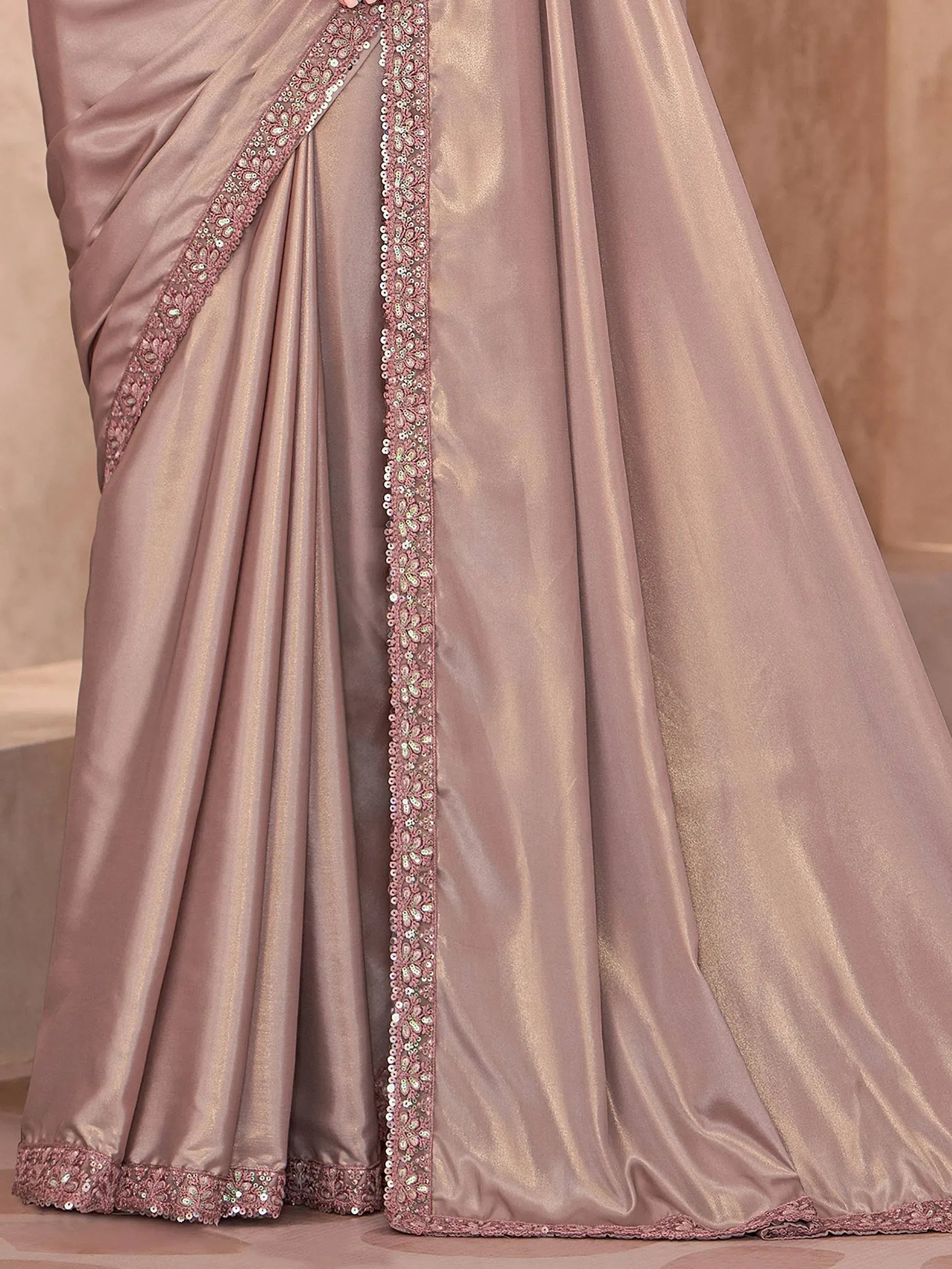 Elegant dusty pink saree with sequin and bead embroidery, perfect for Indian ethnic wear occasions.