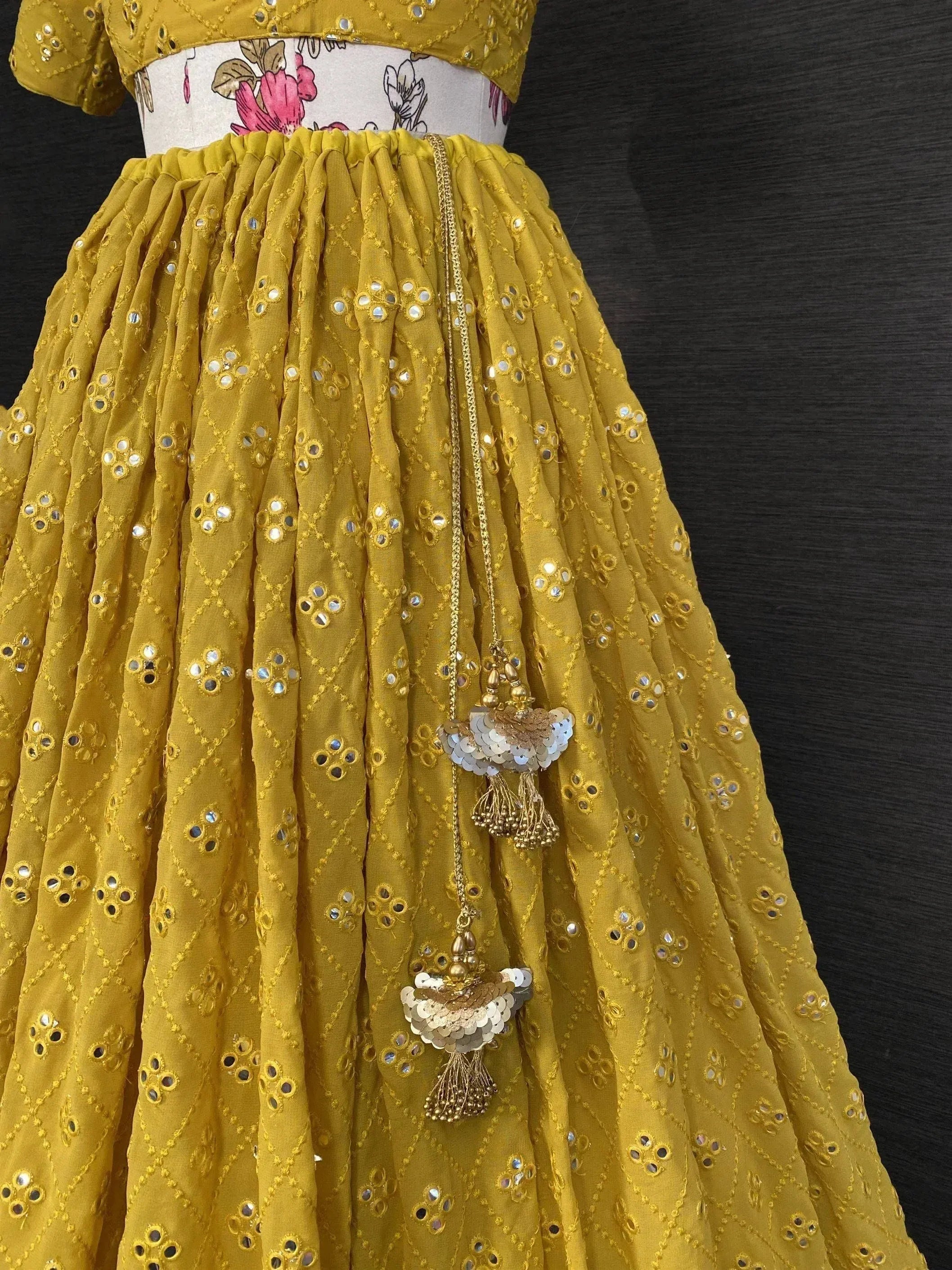 Mustard yellow ethnic skirt with mirror work and tassels, floral waistband, Indian designer wear