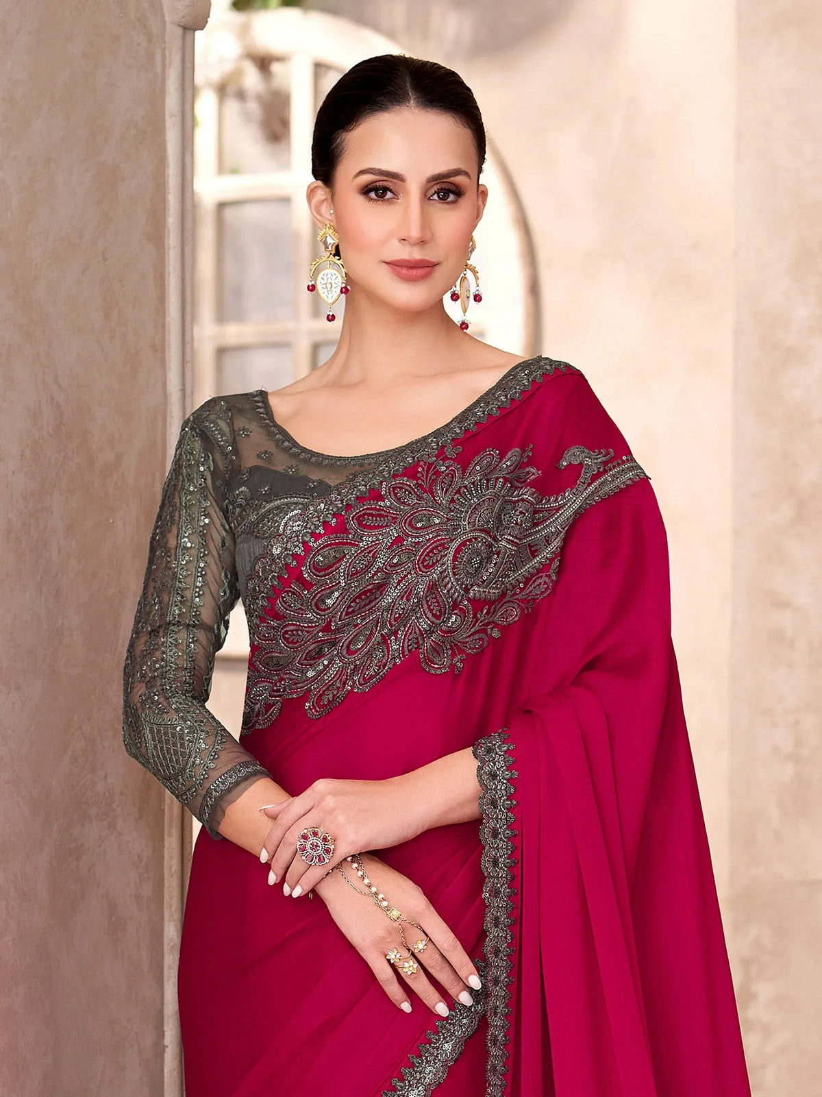 Elegant maroon saree with silver embroidery and sheer blouse, perfect for Indian ethnic occasions