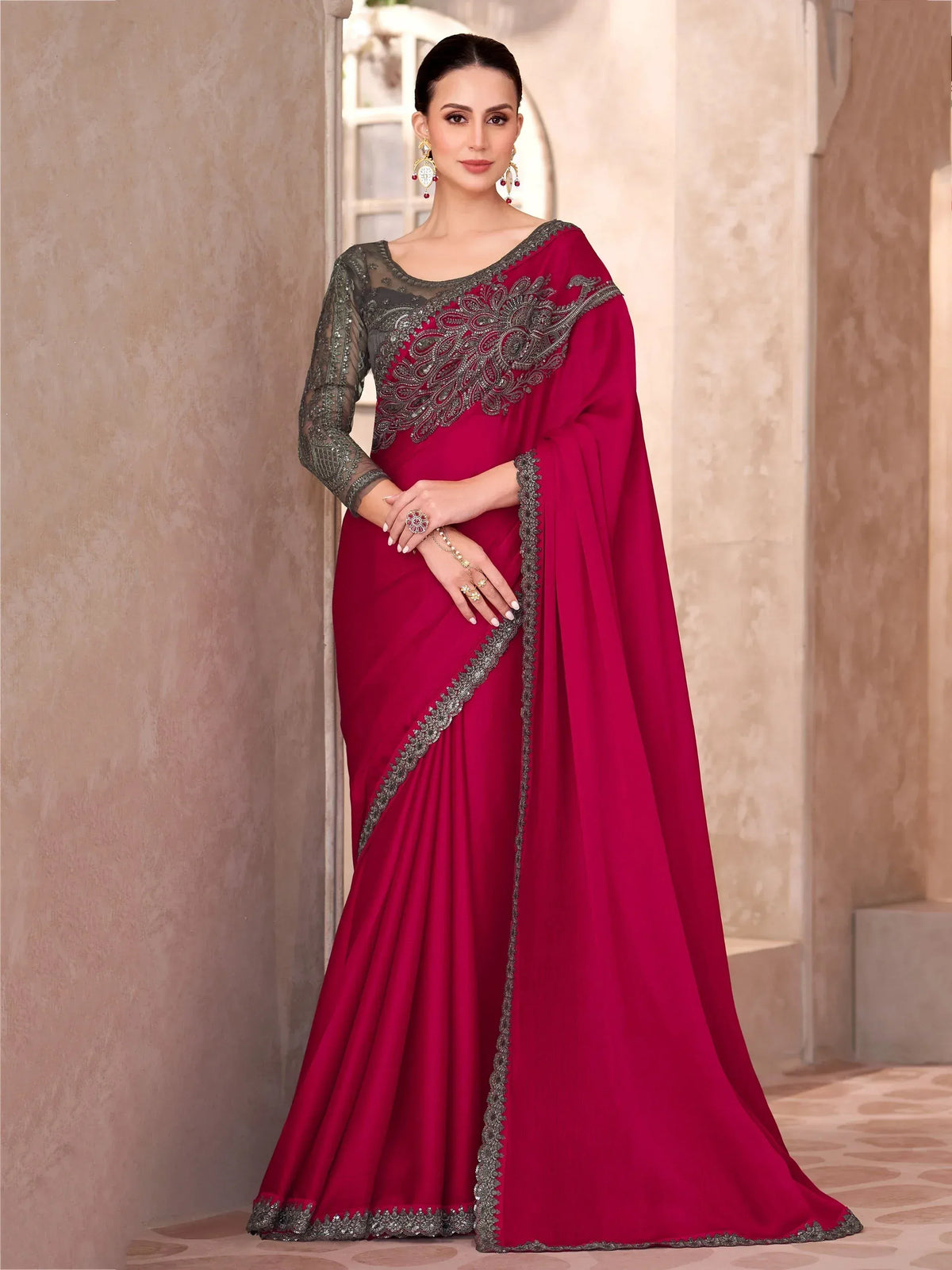 Elegant maroon saree with silver embroidery and sheer blouse, perfect for Indian ethnic occasions