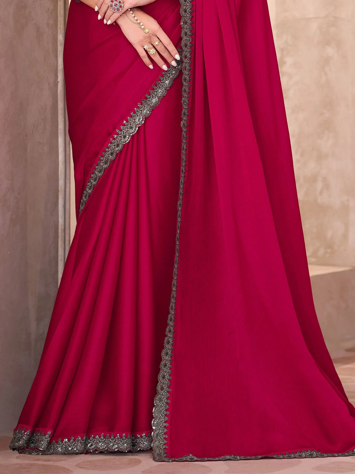 Elegant maroon saree with silver embroidery, perfect for Indian ethnic wear occasions.