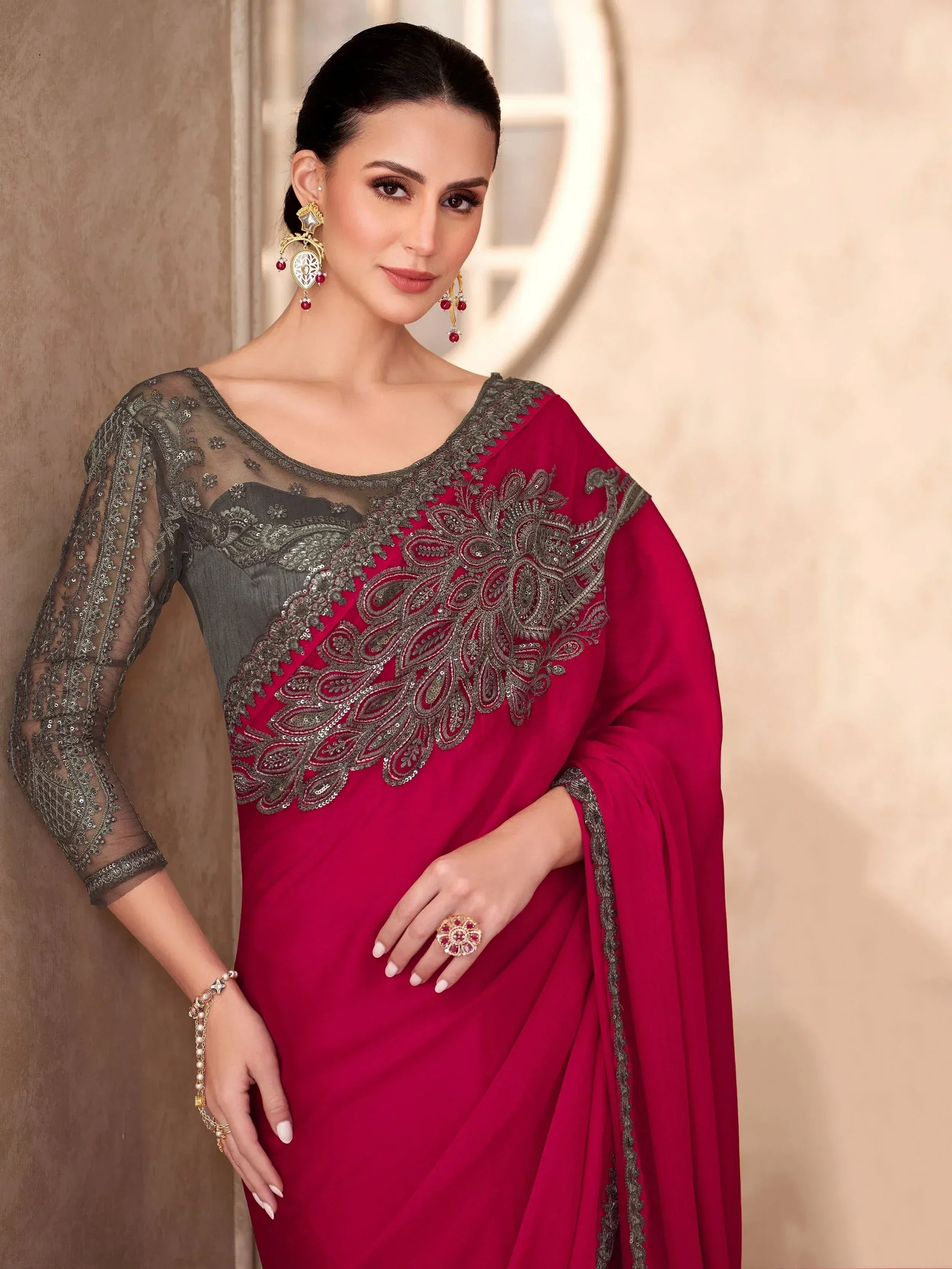 Elegant red and grey embroidered saree with sheer sleeves, perfect for Indian ethnic occasions.