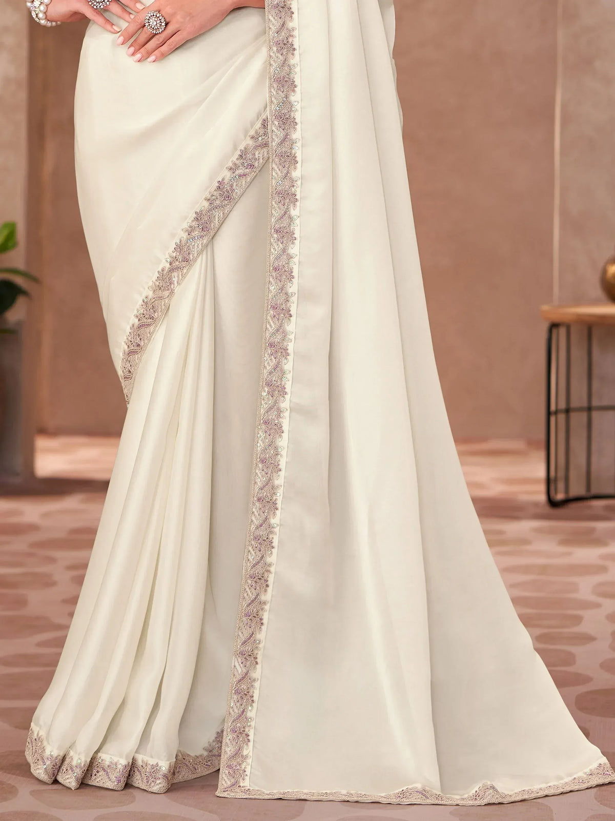 Cream saree with purple and gold embroidery, perfect for Indian ethnic wear occasions