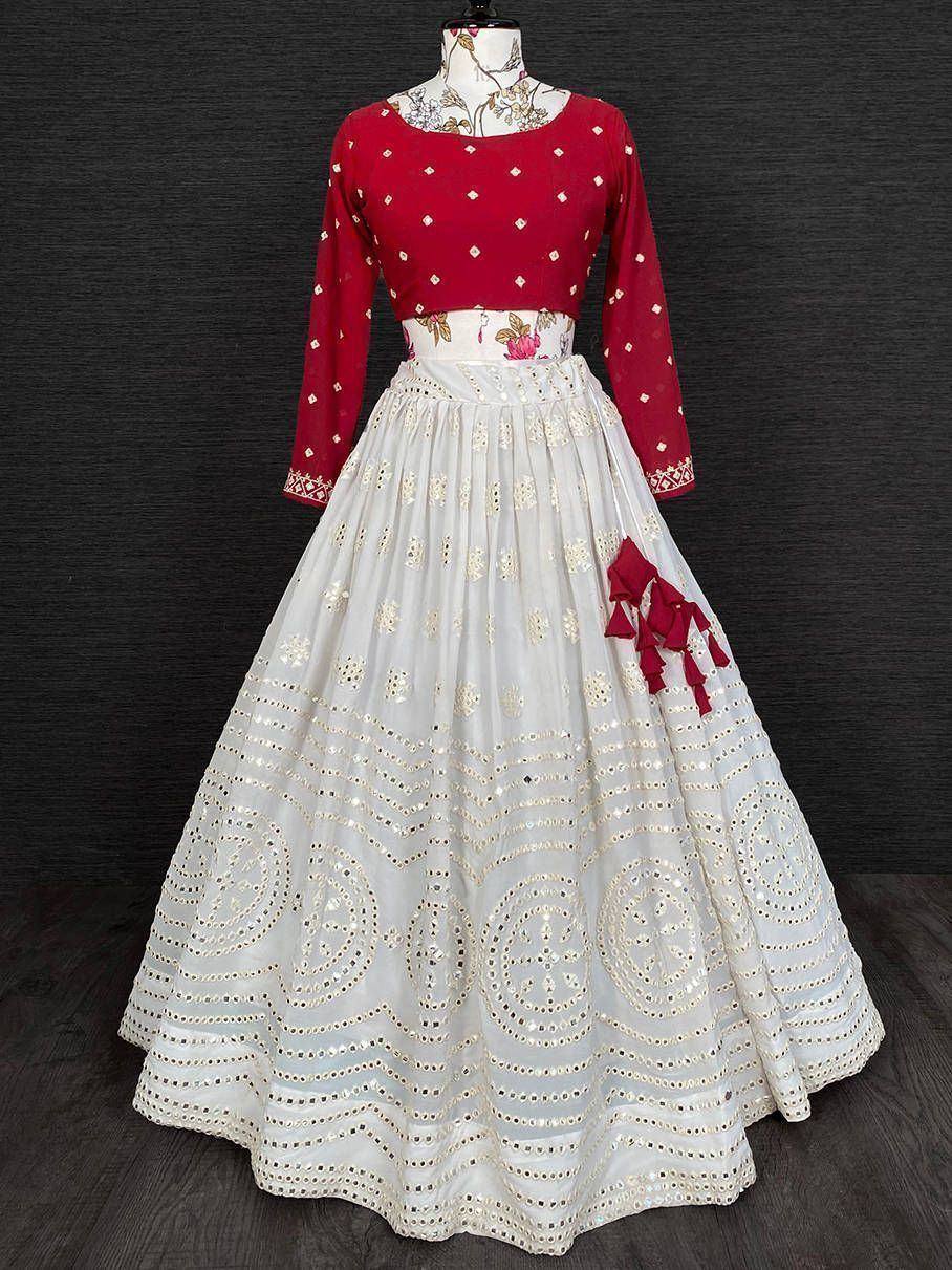 Red and white embroidered lehenga choli with mirror work and floral belt, ideal for Indian ethnic occasions.