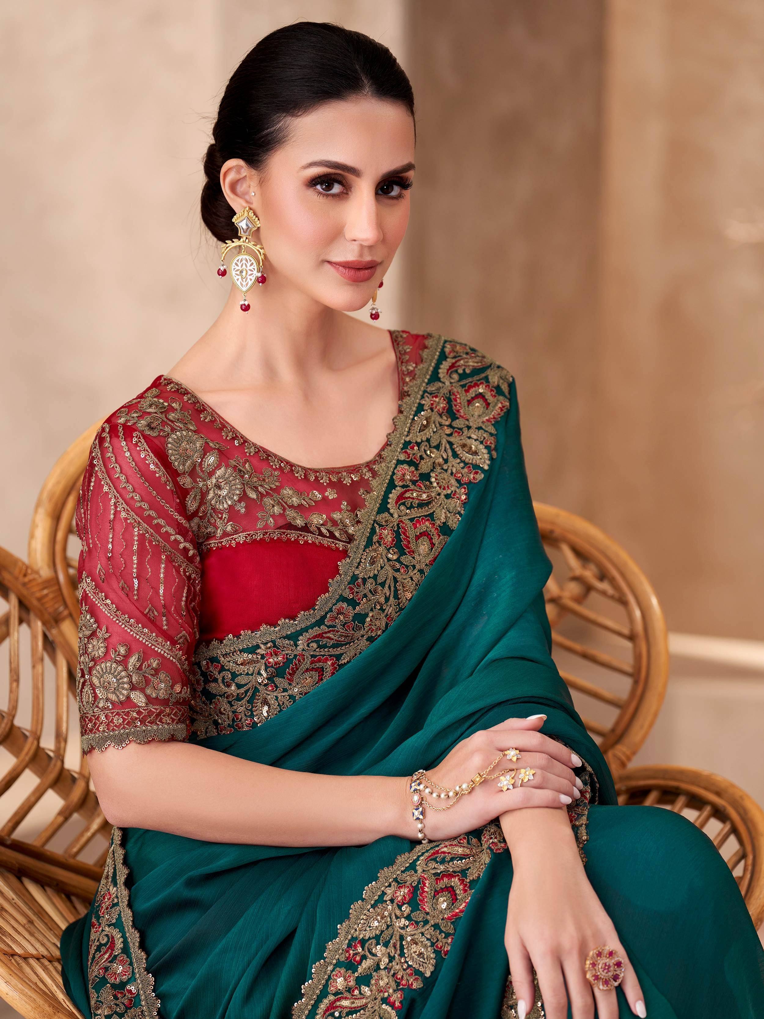 Elegant green and red embroidered saree with gold detailing, perfect for Indian ethnic wear occasions.