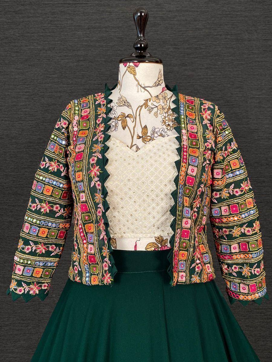 Green embroidered jacket with floral patterns, paired with cream blouse and skirt for ethnic wear