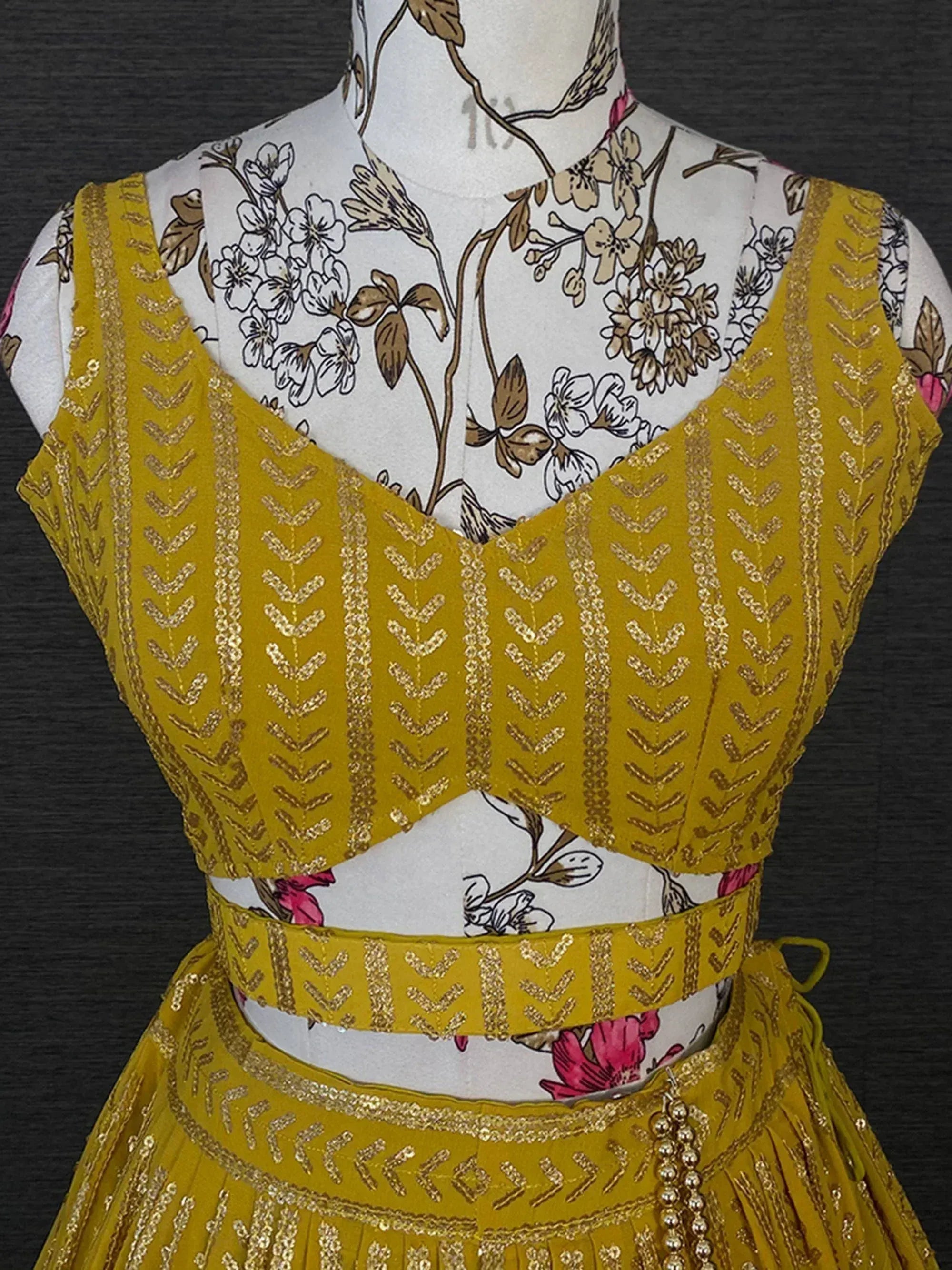 Mustard yellow ethnic lehenga choli with gold chevron embroidery, perfect for Indian weddings and festivals