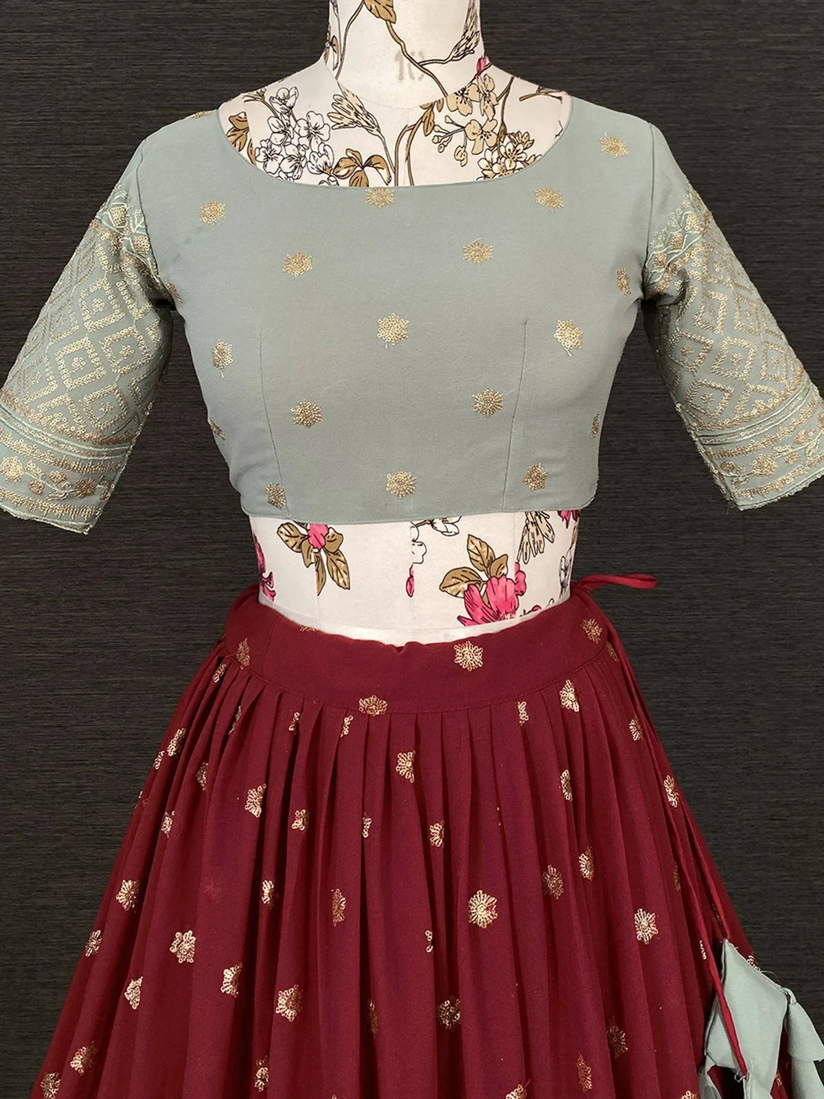 Mint green and maroon lehenga choli with gold embroidery, perfect for Indian ethnic wear occasions
