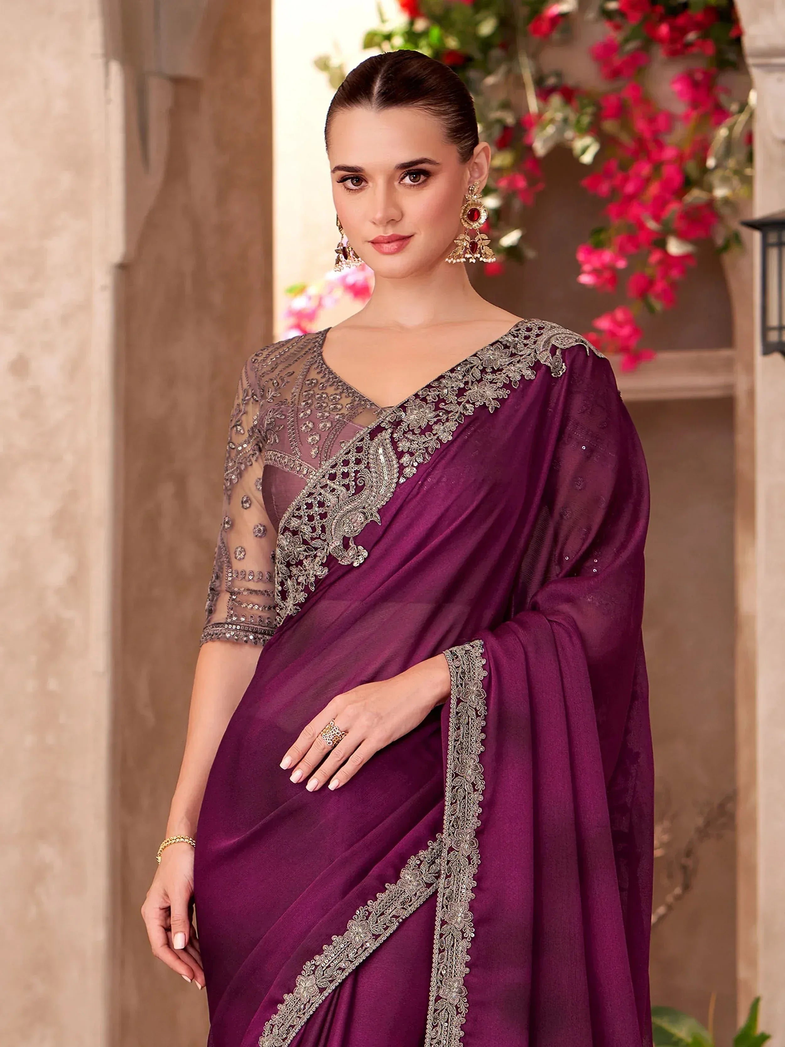 Elegant purple saree with silver embroidery and sheer blouse, perfect for Indian ethnic occasions