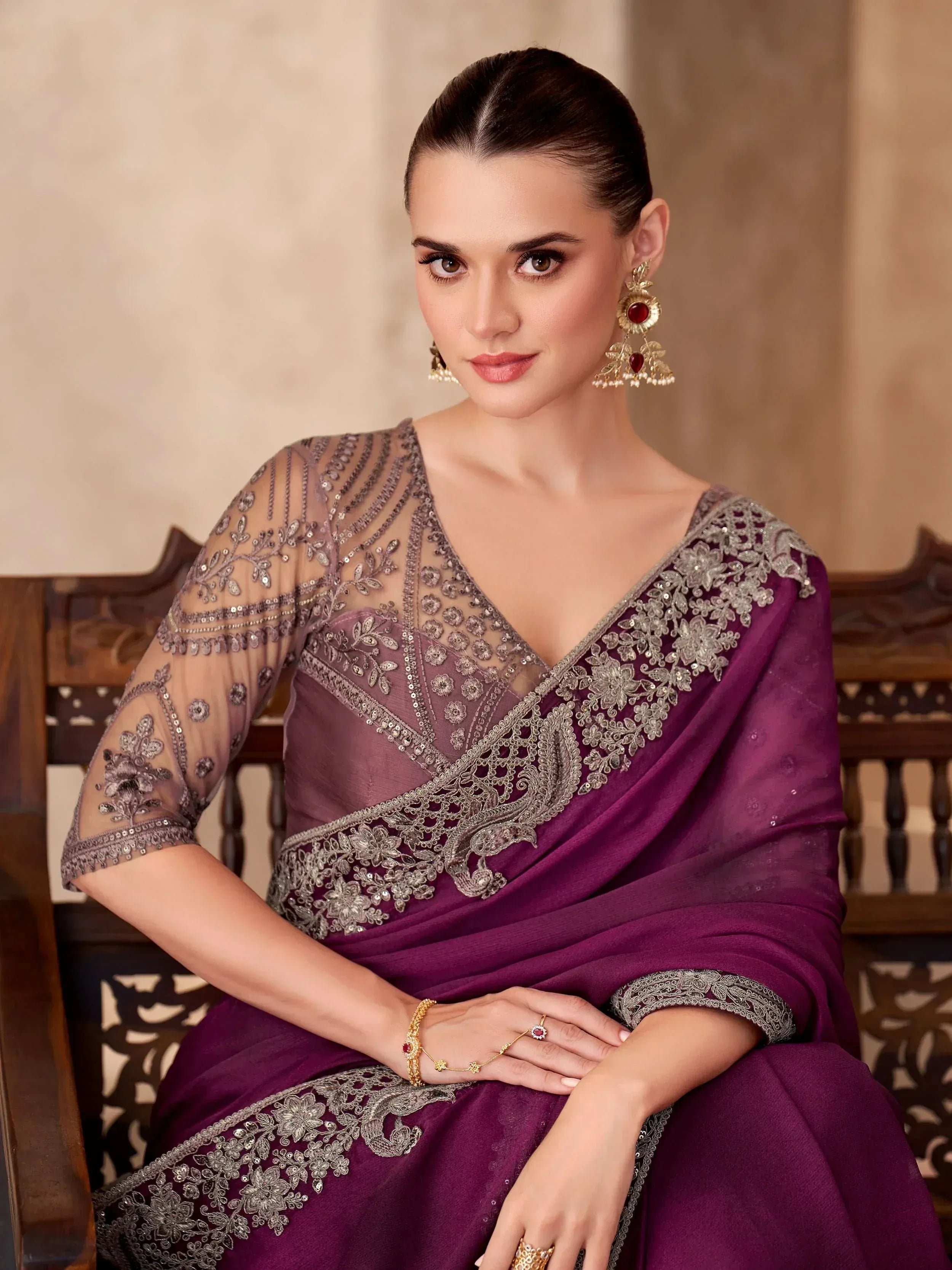 Elegant purple saree with silver embroidery, perfect for Indian ethnic wear occasions.