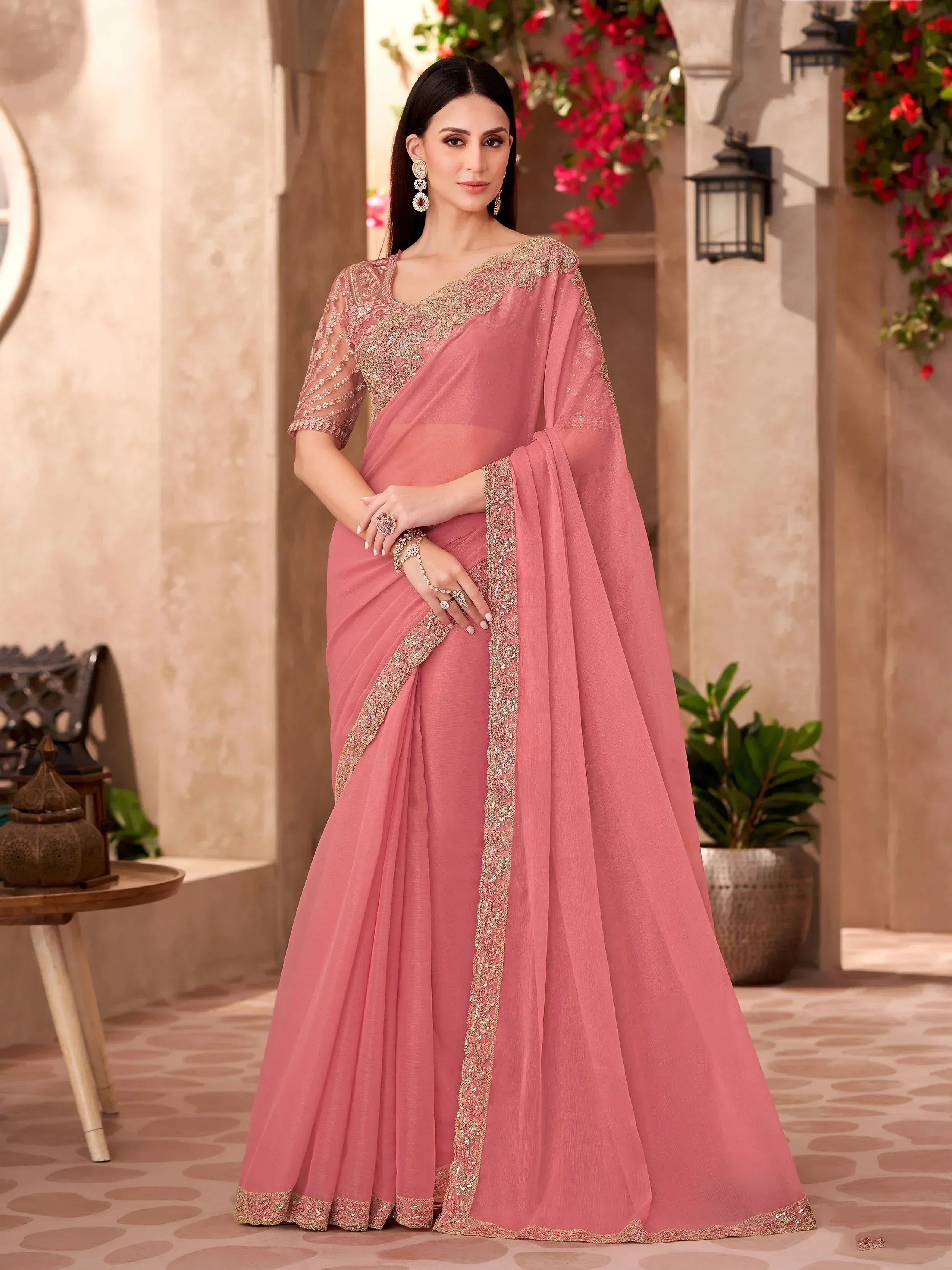 Elegant pink saree with gold embroidery, perfect for Indian ethnic wear occasions.