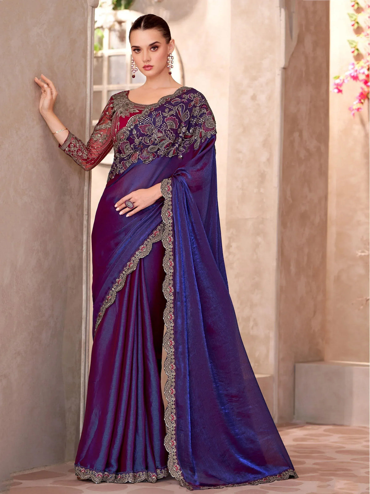 Elegant purple and maroon embroidered saree with floral detailing, perfect for Indian ethnic wear occasions.