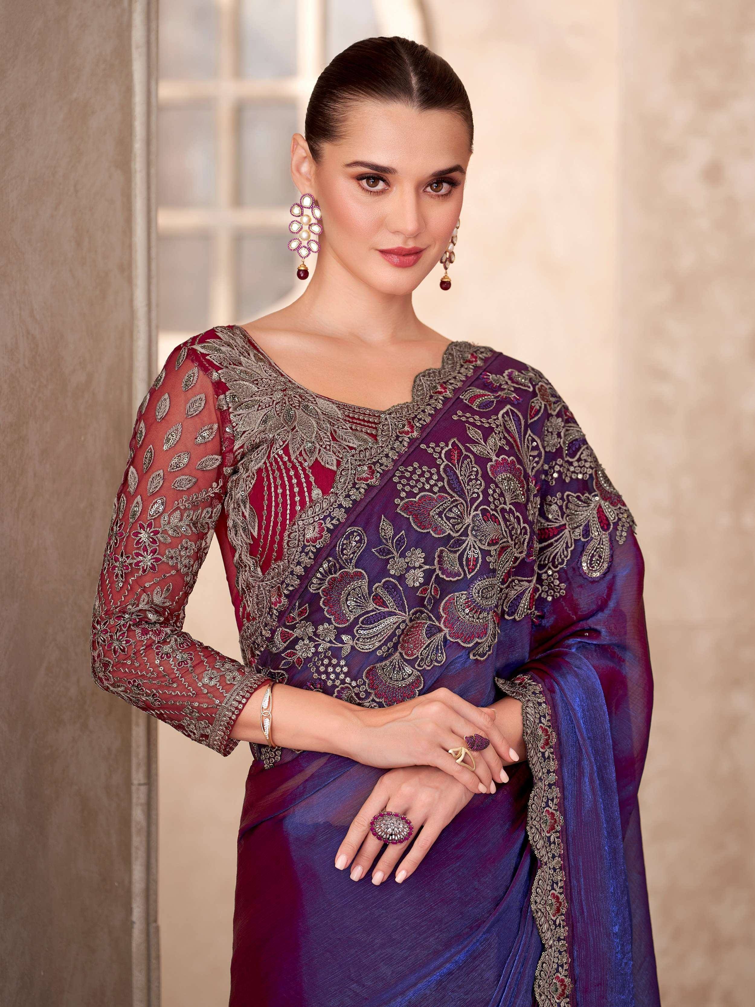 Elegant purple and maroon embroidered saree with heavy zari work, perfect for Indian ethnic occasions.