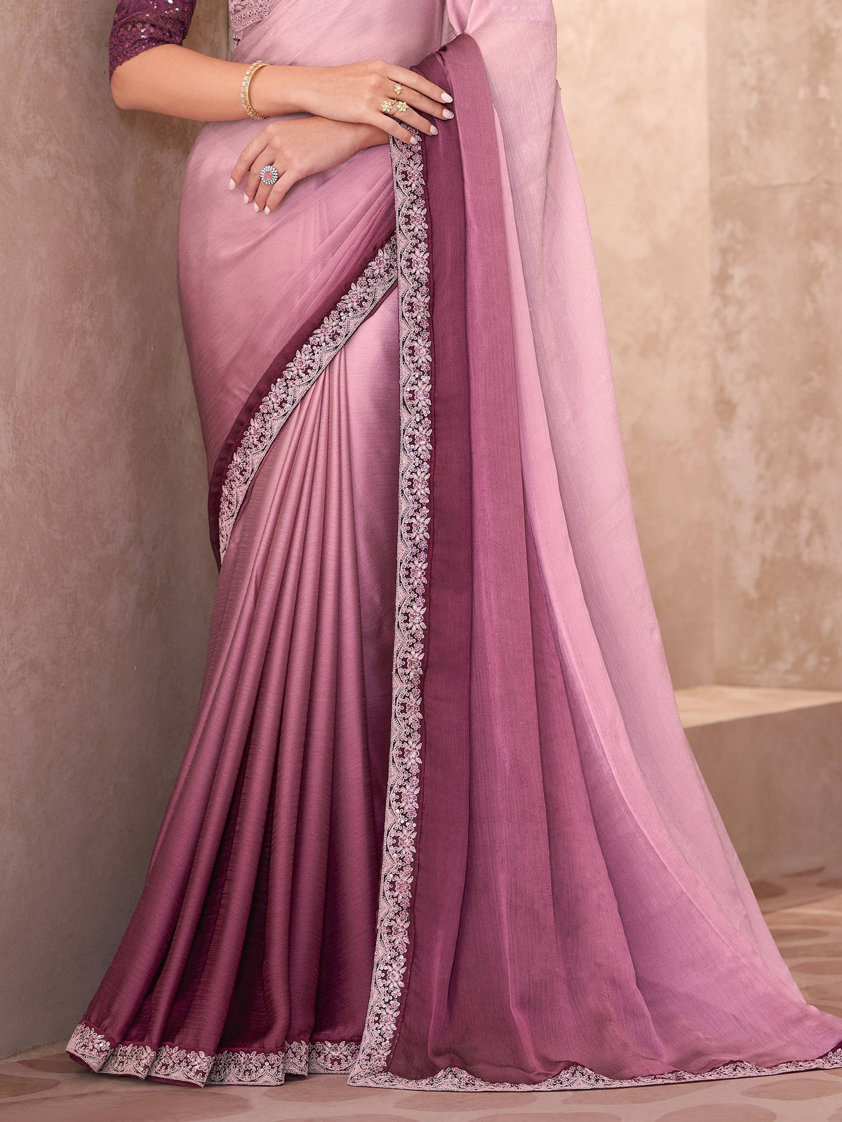 Elegant pink and purple saree with floral lace border, perfect for Indian ethnic occasions