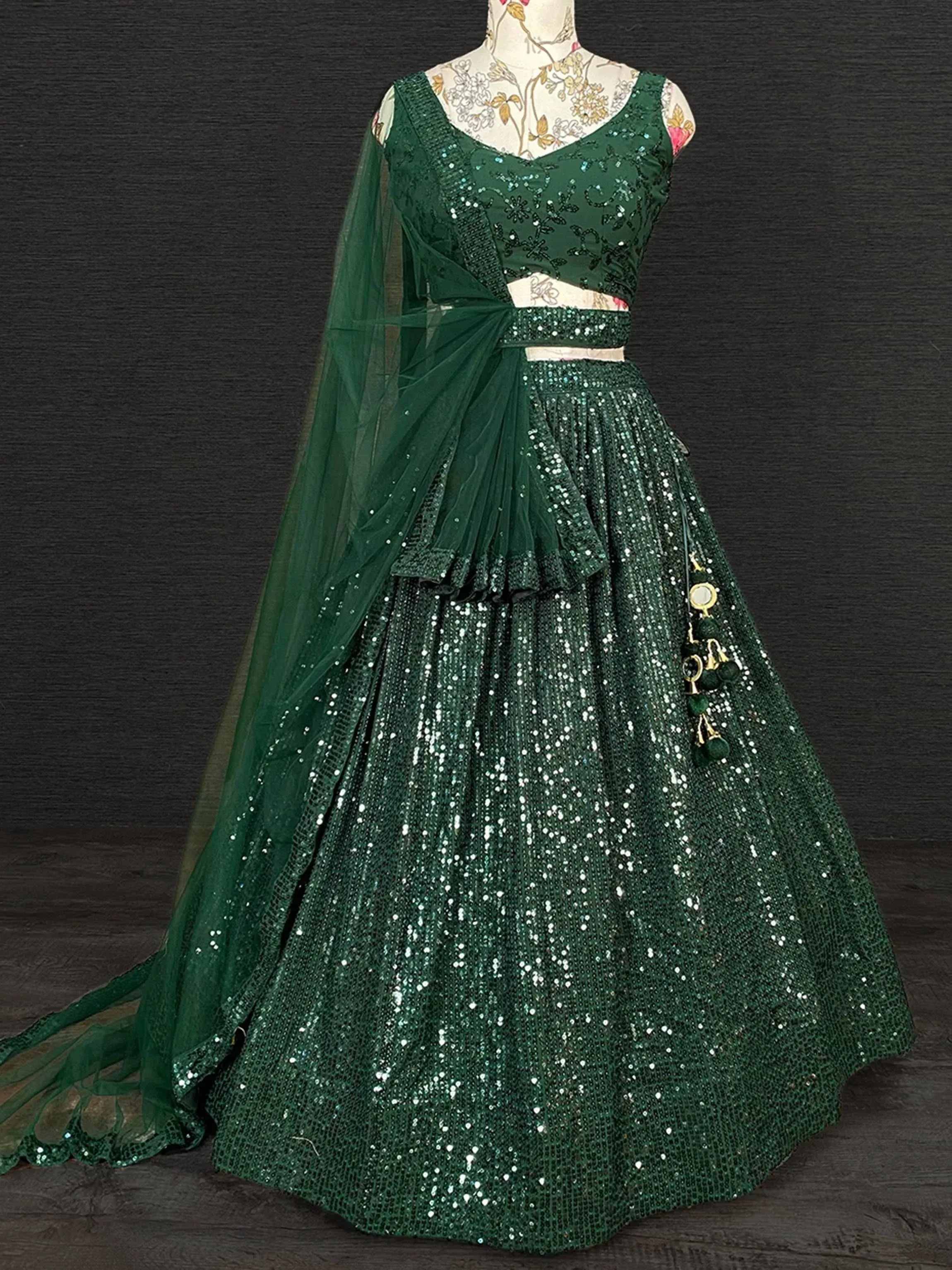 Emerald green sequin lehenga choli with sheer dupatta, perfect for Indian ethnic wear events