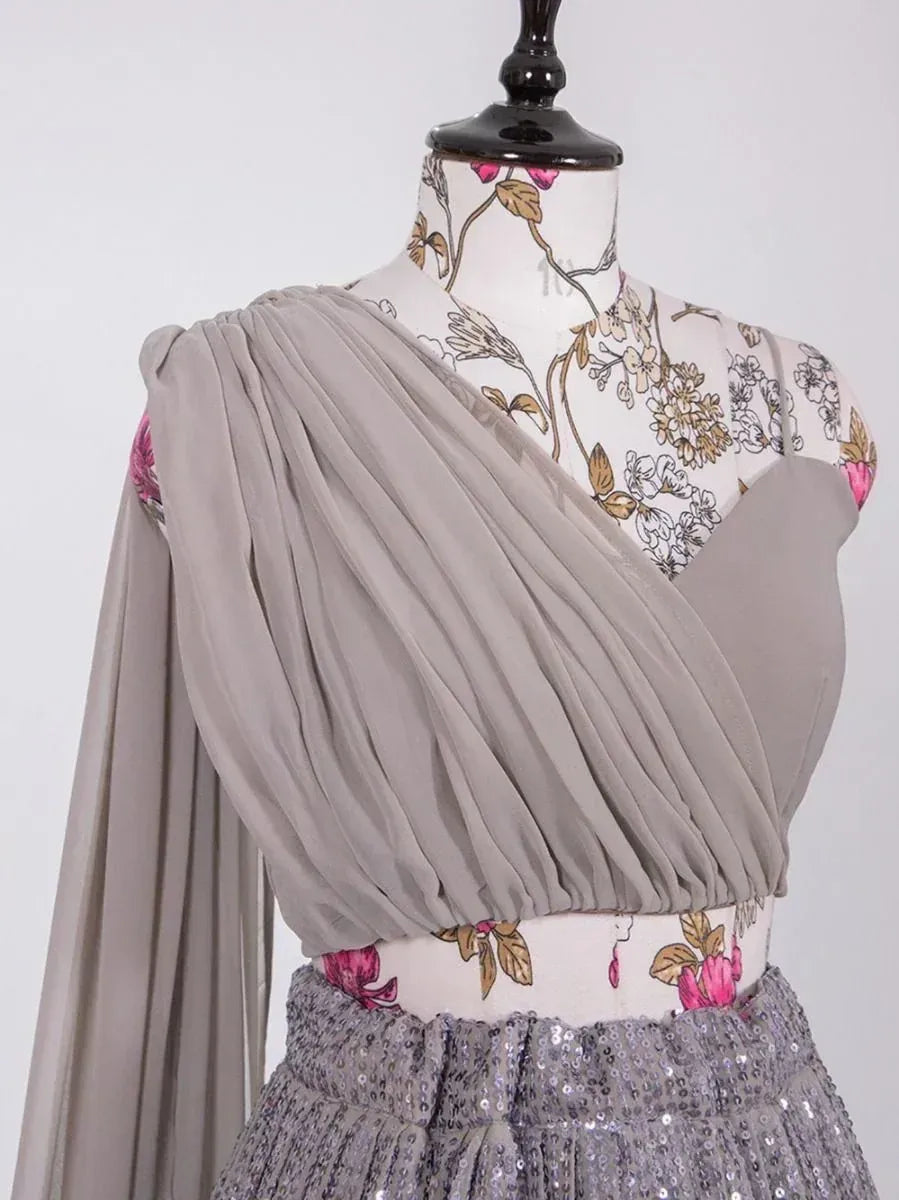 Grey pleated ethnic gown with floral print bodice and sequin skirt, perfect for Indian occasions.