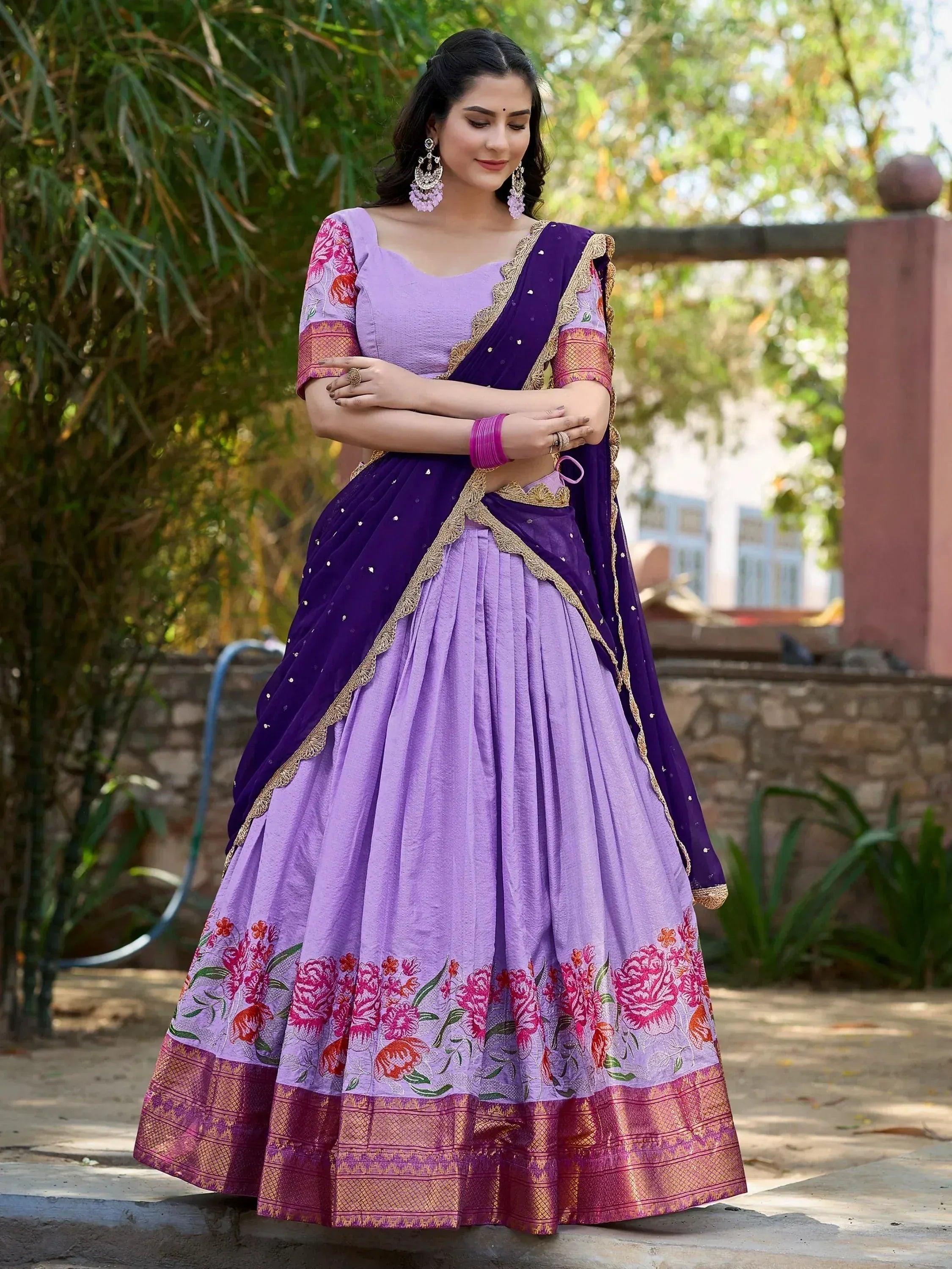 Purple floral lehenga choli with gold border, perfect for Indian ethnic wear occasions