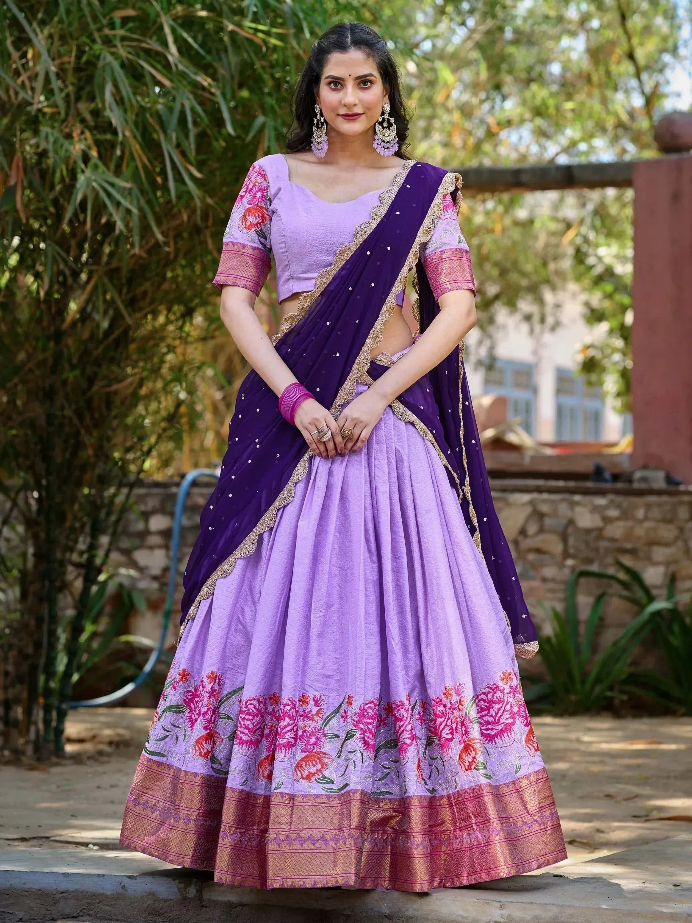 Purple and lavender lehenga choli with floral embroidery and gold border, perfect for Indian ethnic occasions