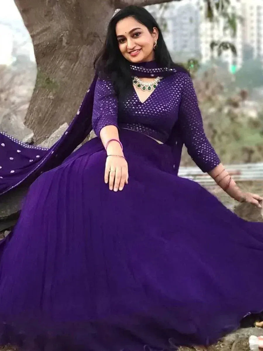 Purple ethnic gown with net dupatta, perfect for Indian occasions and festive wear