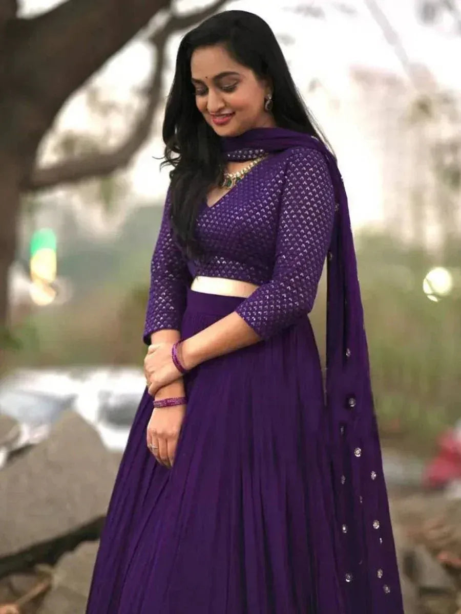 Purple designer lehenga choli with embroidered blouse and pleated skirt, perfect for ethnic occasions