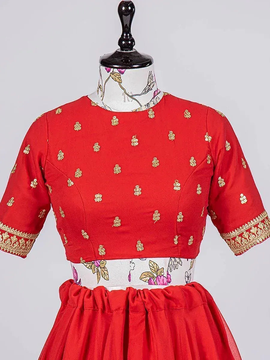 Red ethnic crop top with gold embroidery, paired with matching skirt, ideal for Indian festive wear