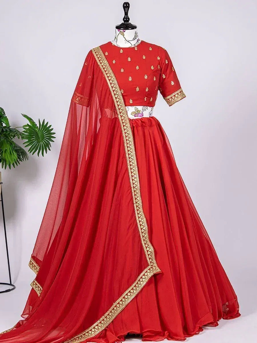 Red designer lehenga choli with gold embroidery and sheer dupatta, perfect for Indian ethnic occasions
