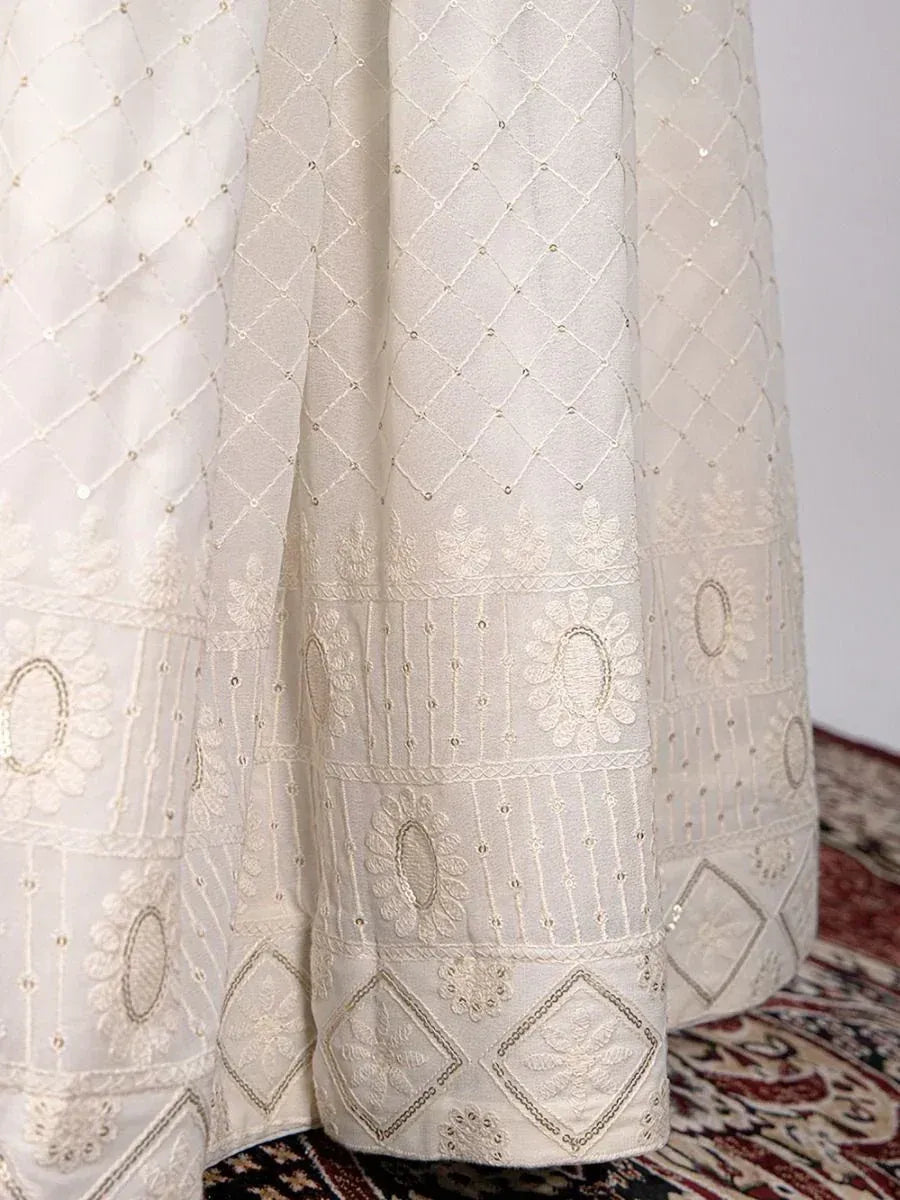 White ethnic lehenga with diamond embroidery and floral motifs, ideal for Indian weddings and festivals
