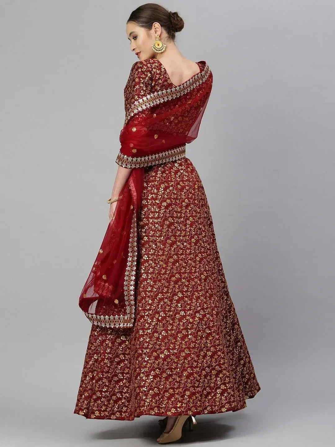 Red embroidered lehenga choli with gold floral motifs and matching dupatta, ideal for Indian ethnic occasions