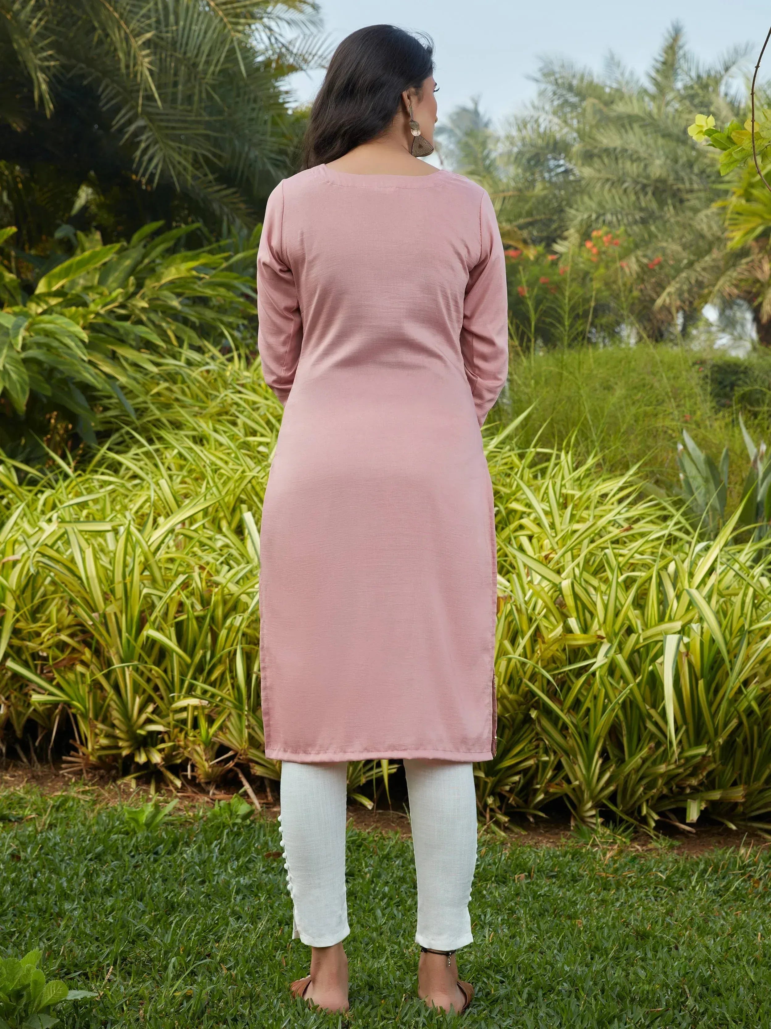 Pink ethnic kurta with white pants, back view in garden setting