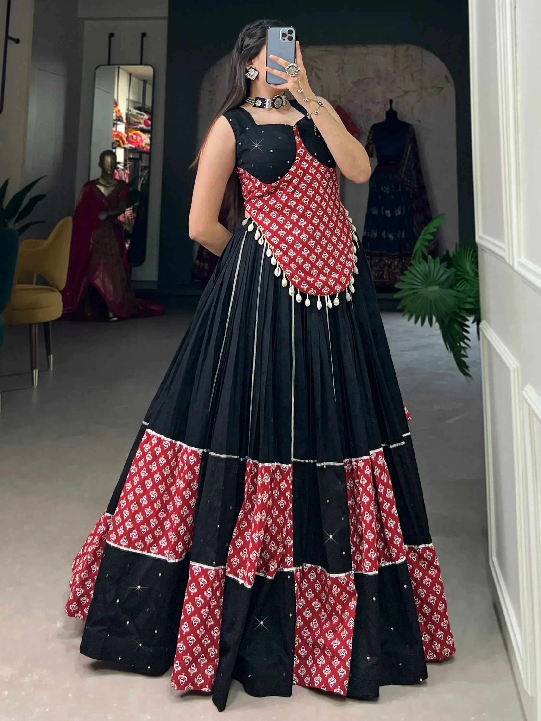 Black and red printed lehenga choli with mirror work, perfect for Indian ethnic wear events