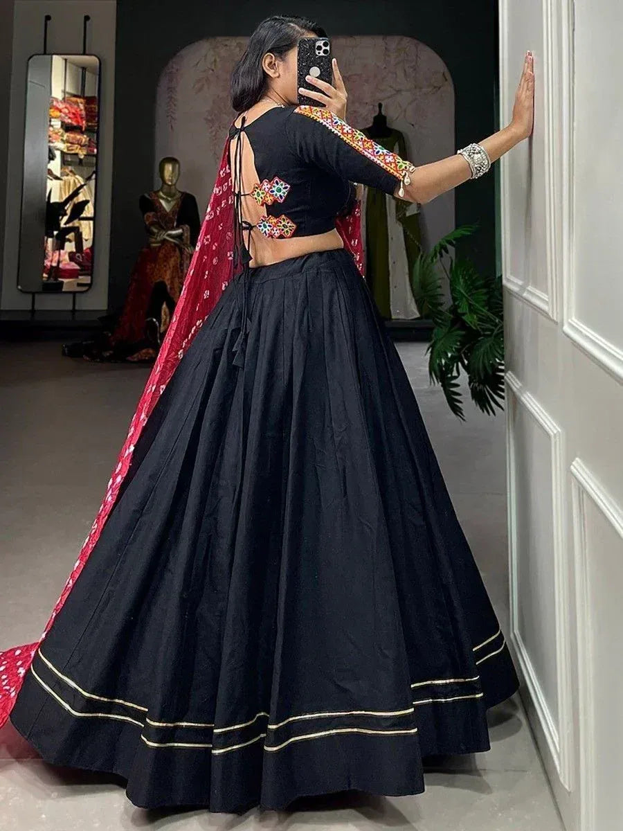 Black lehenga choli with colorful embroidery and red dupatta, ethnic Indian wear for women