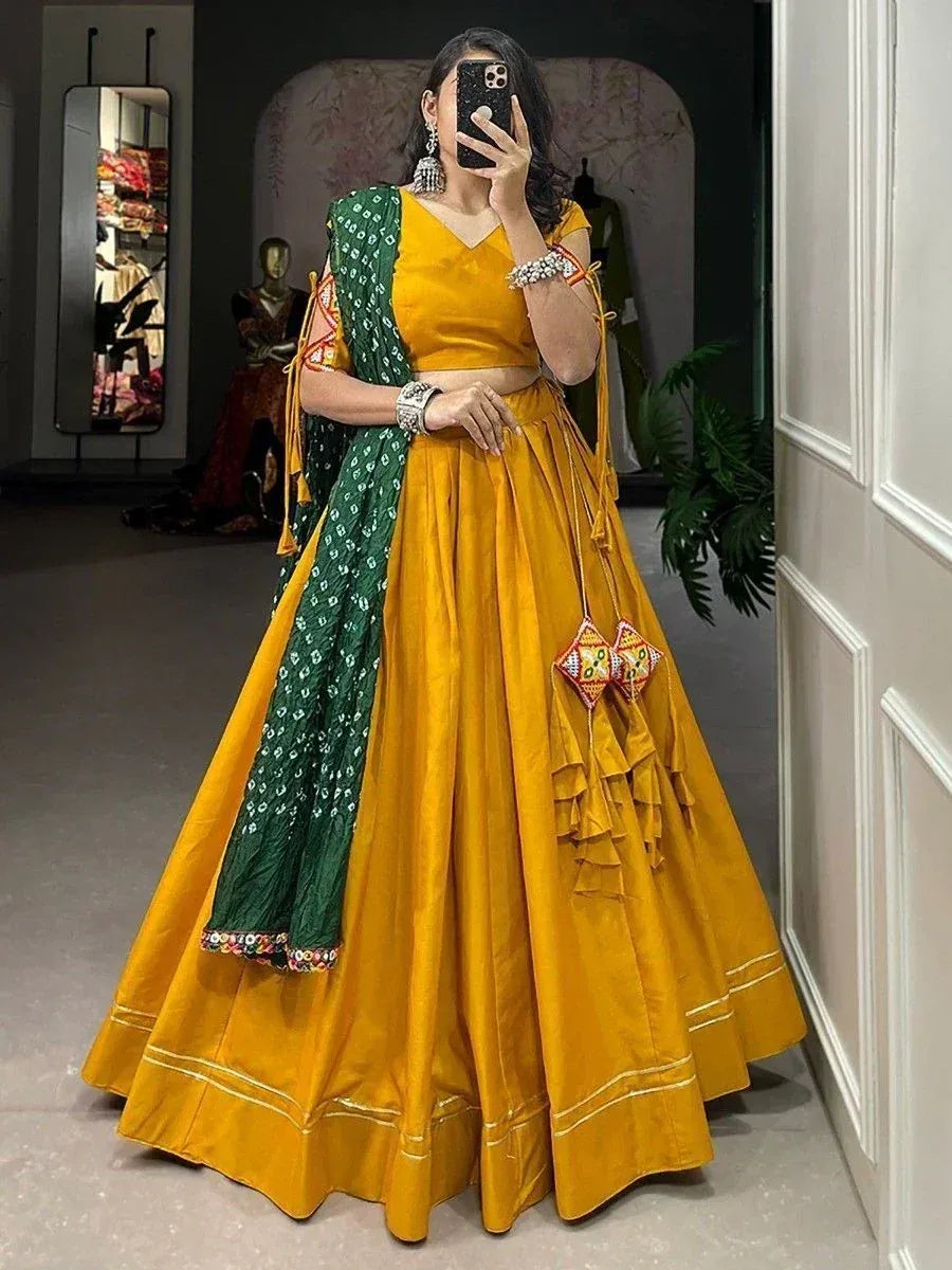 Mustard yellow lehenga choli with green dupatta, perfect for Indian ethnic occasions and weddings