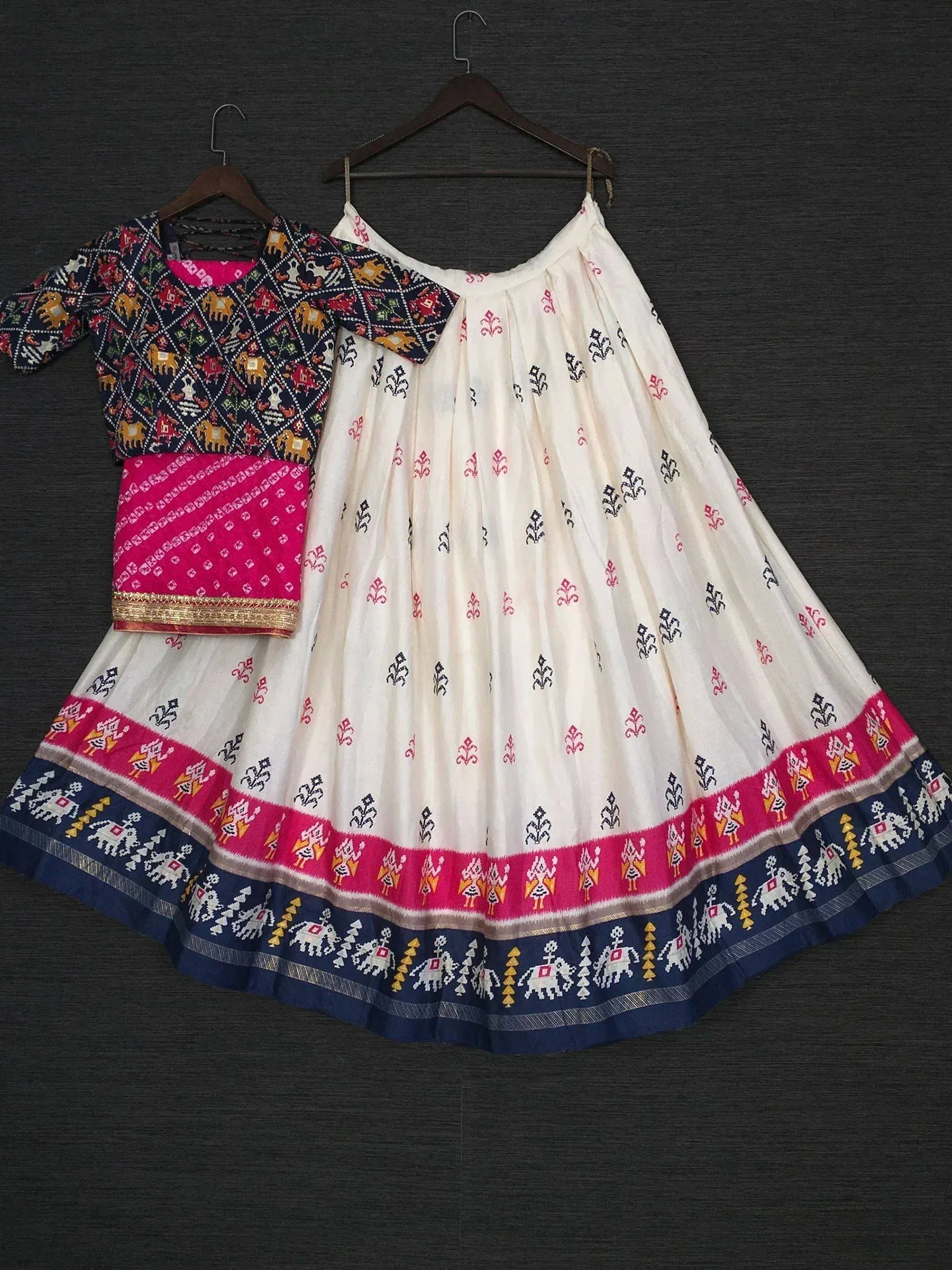 White and navy blue printed lehenga choli with elephant motifs, perfect for Indian ethnic wear occasions.