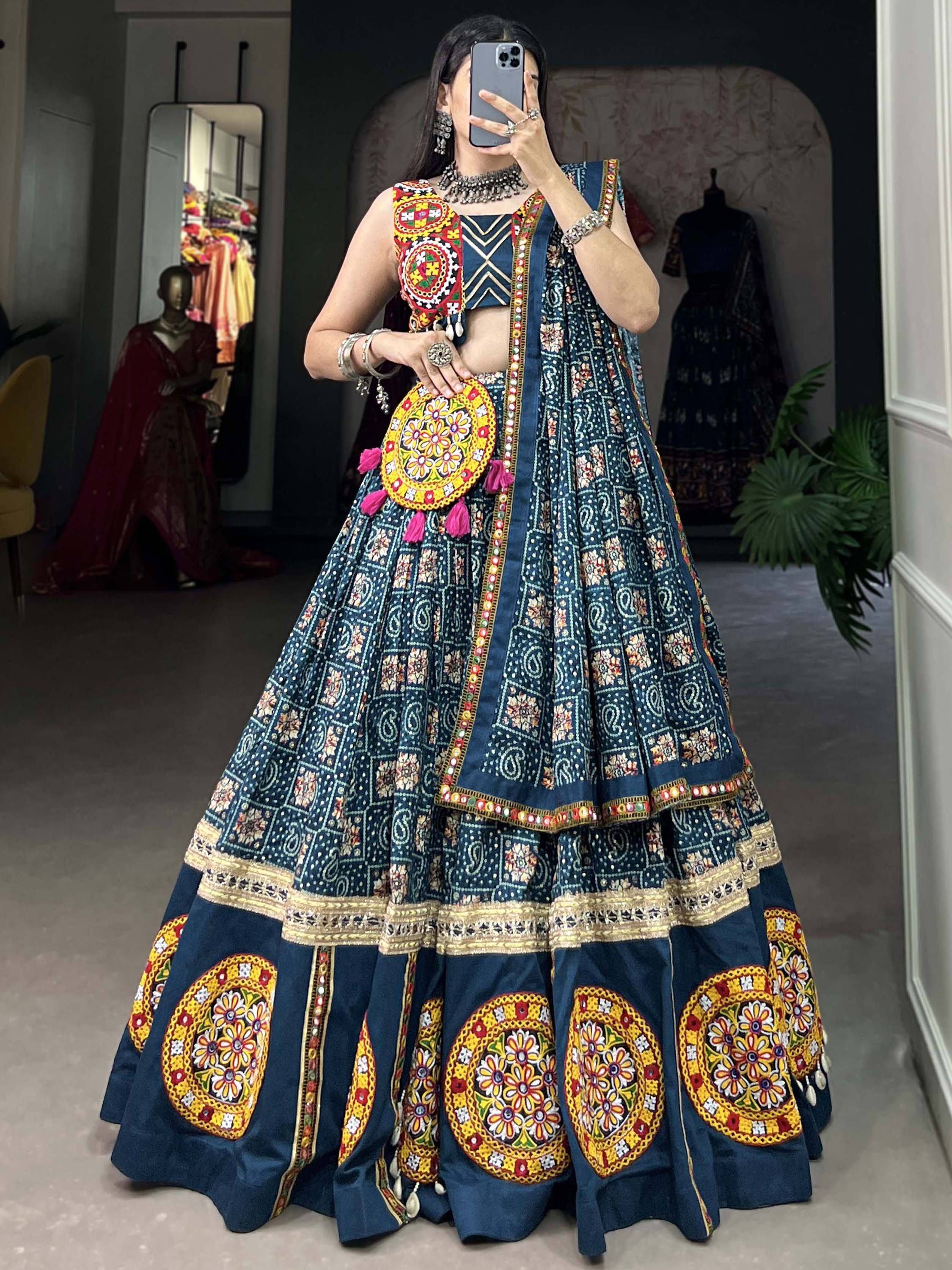 Blue embroidered lehenga choli with mirror work and floral motifs, perfect for Indian ethnic wear