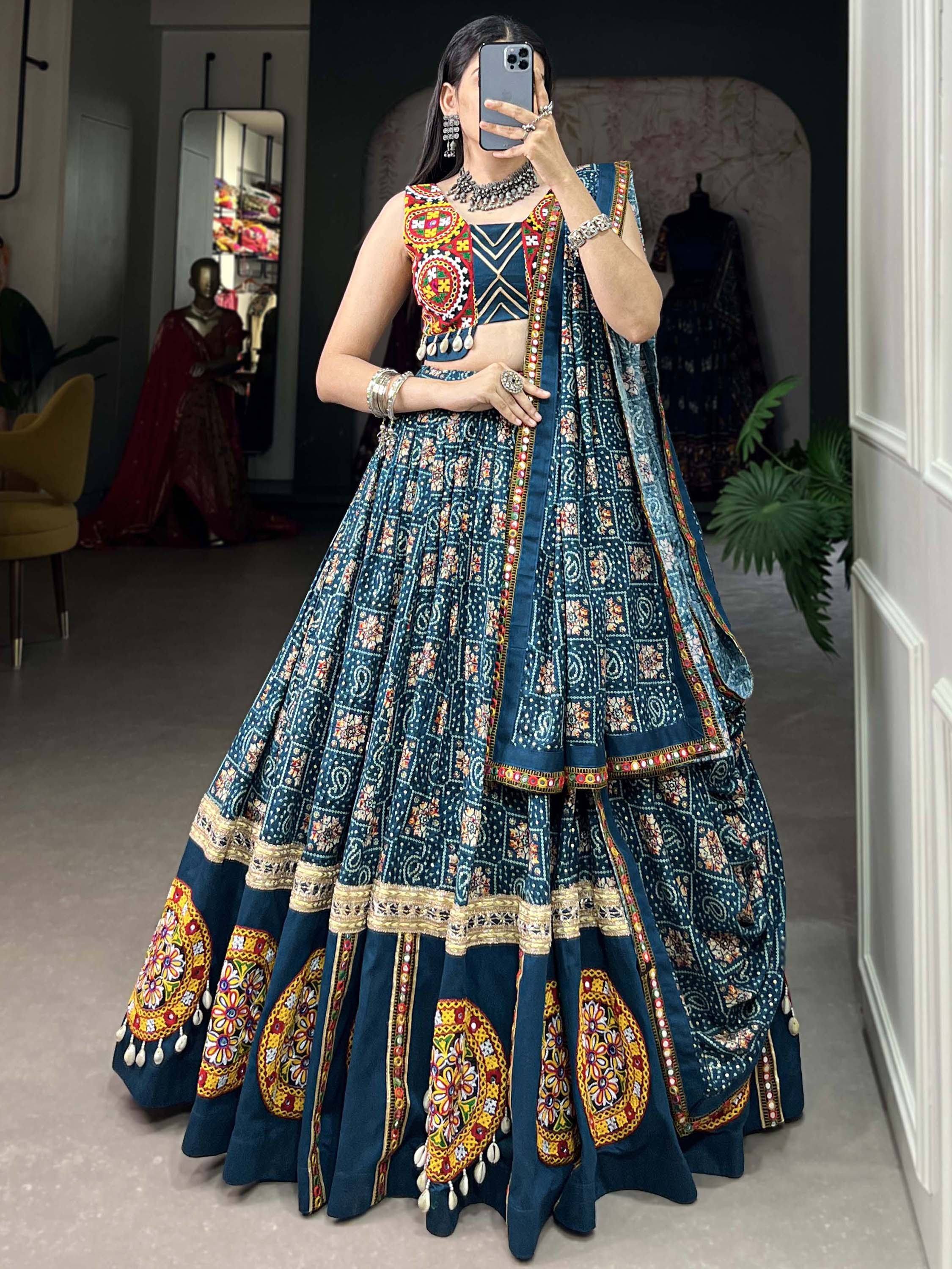 Blue embroidered lehenga choli with mirror work and colorful motifs, perfect for Indian ethnic wear