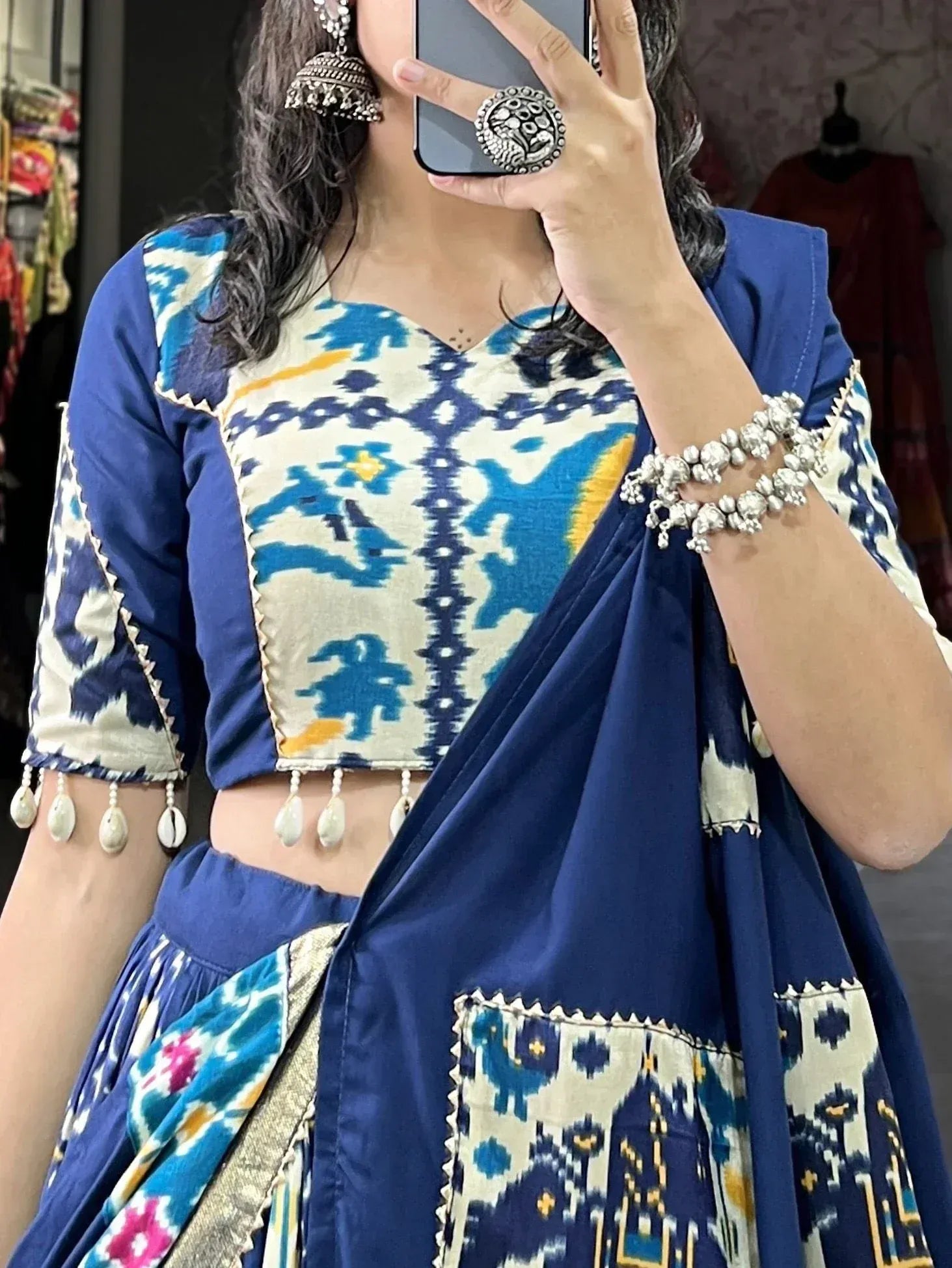 Blue and white ikat print lehenga choli with tassels, traditional Indian ethnic wear