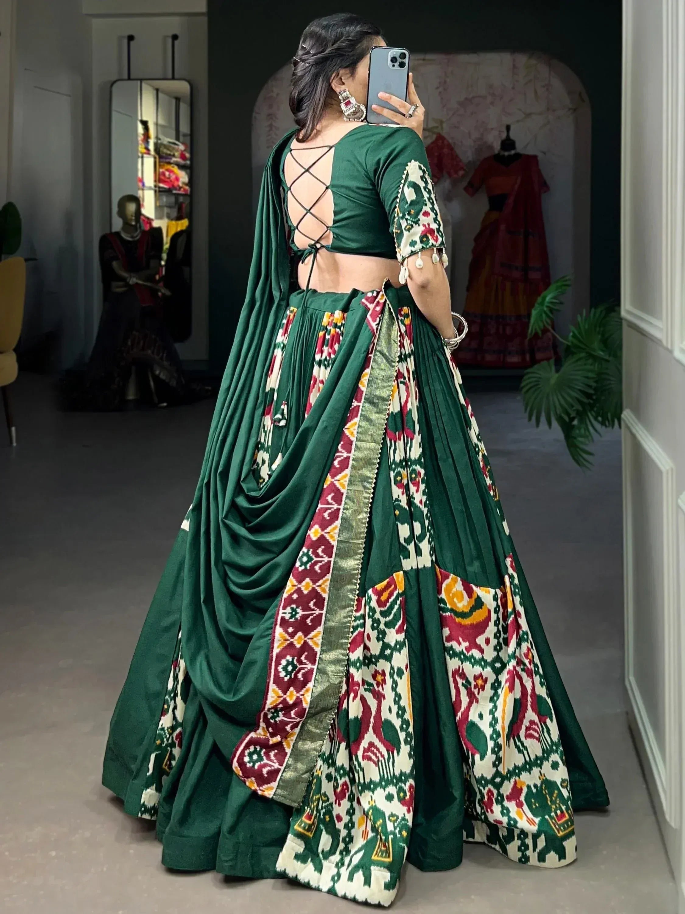 Green lehenga choli with crisscross back and floral ikat print, ethnic Indian wear