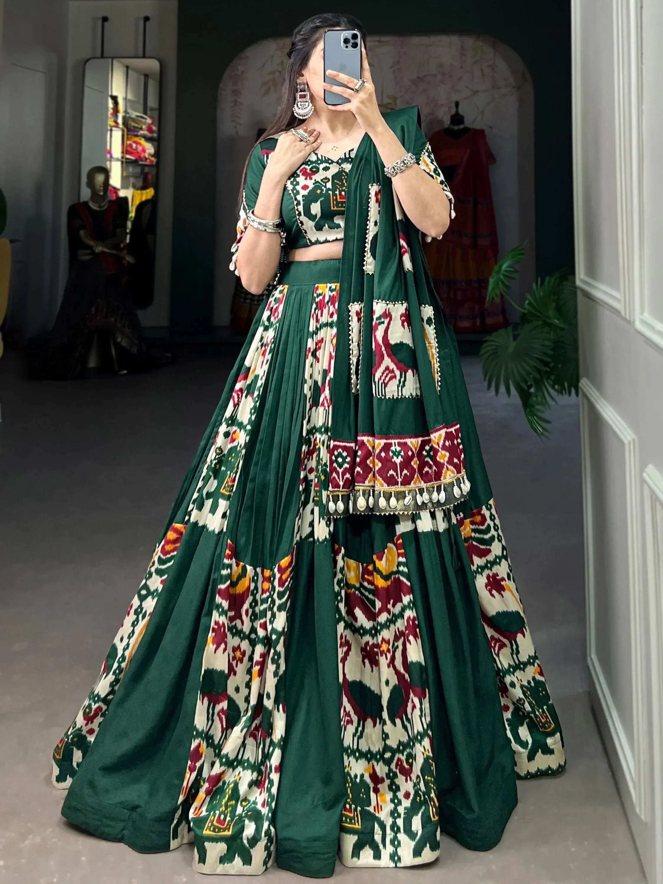 Green and ivory printed lehenga choli with elephant motifs, perfect for Indian ethnic wear occasions