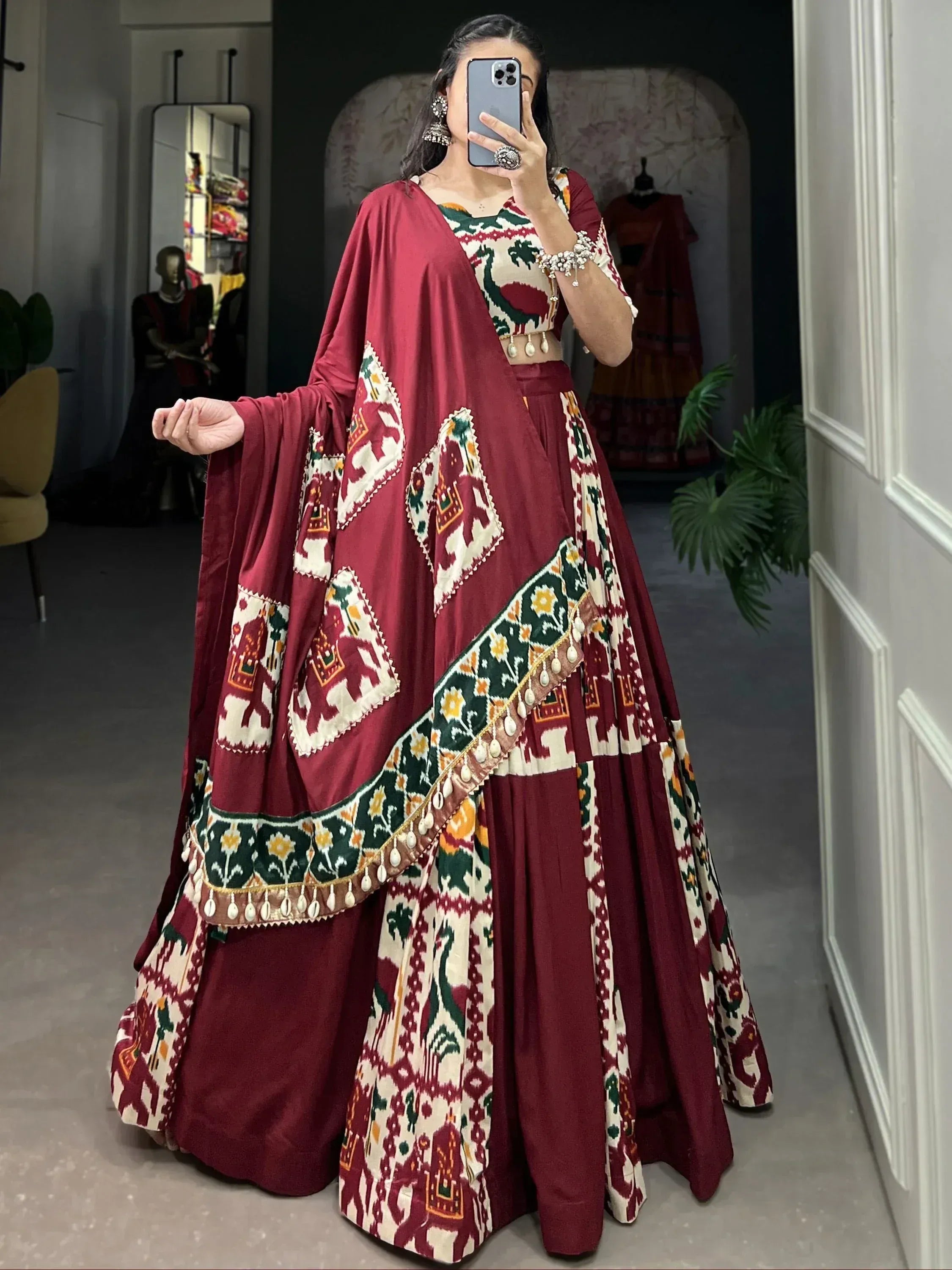 Maroon ethnic lehenga choli with elephant print and dupatta, perfect for Indian weddings and festivals