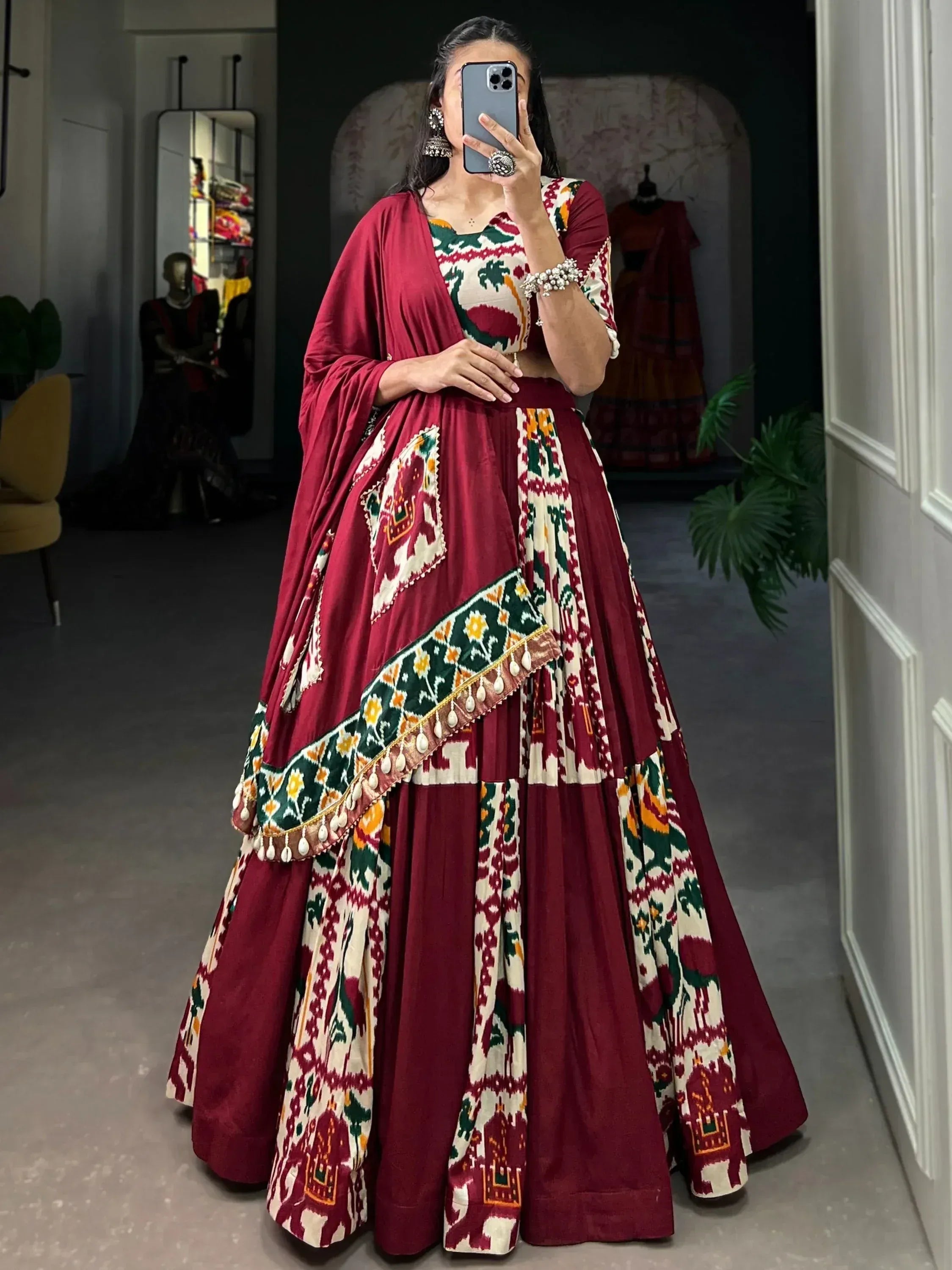 Maroon and white printed lehenga choli with elephant motifs, perfect for Indian ethnic wear occasions