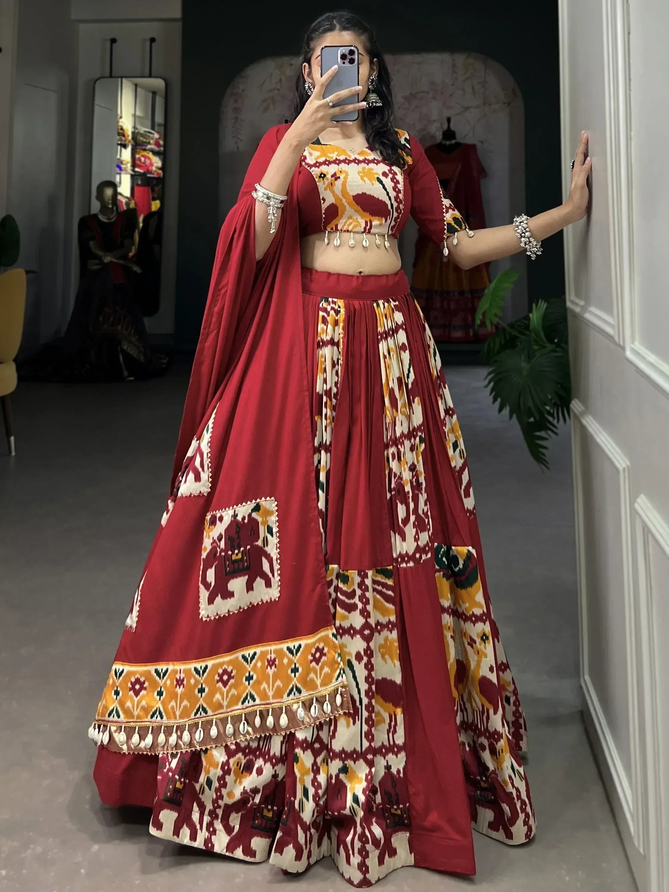 Red and cream printed lehenga choli with elephant motifs, perfect for Indian ethnic wear occasions