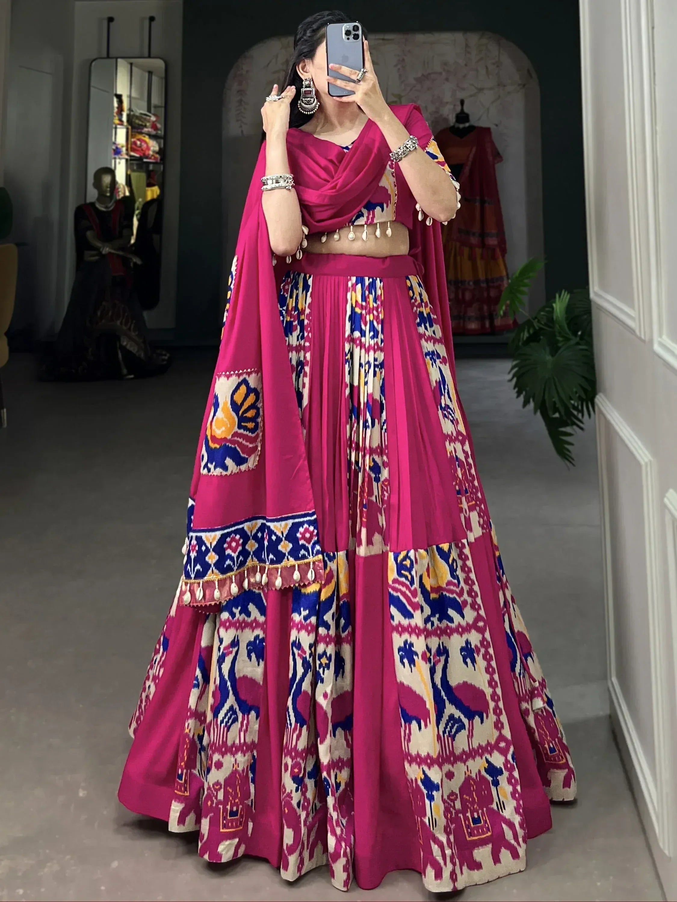 Vibrant pink lehenga choli with ikat print, perfect for Indian ethnic wear and festive occasions.