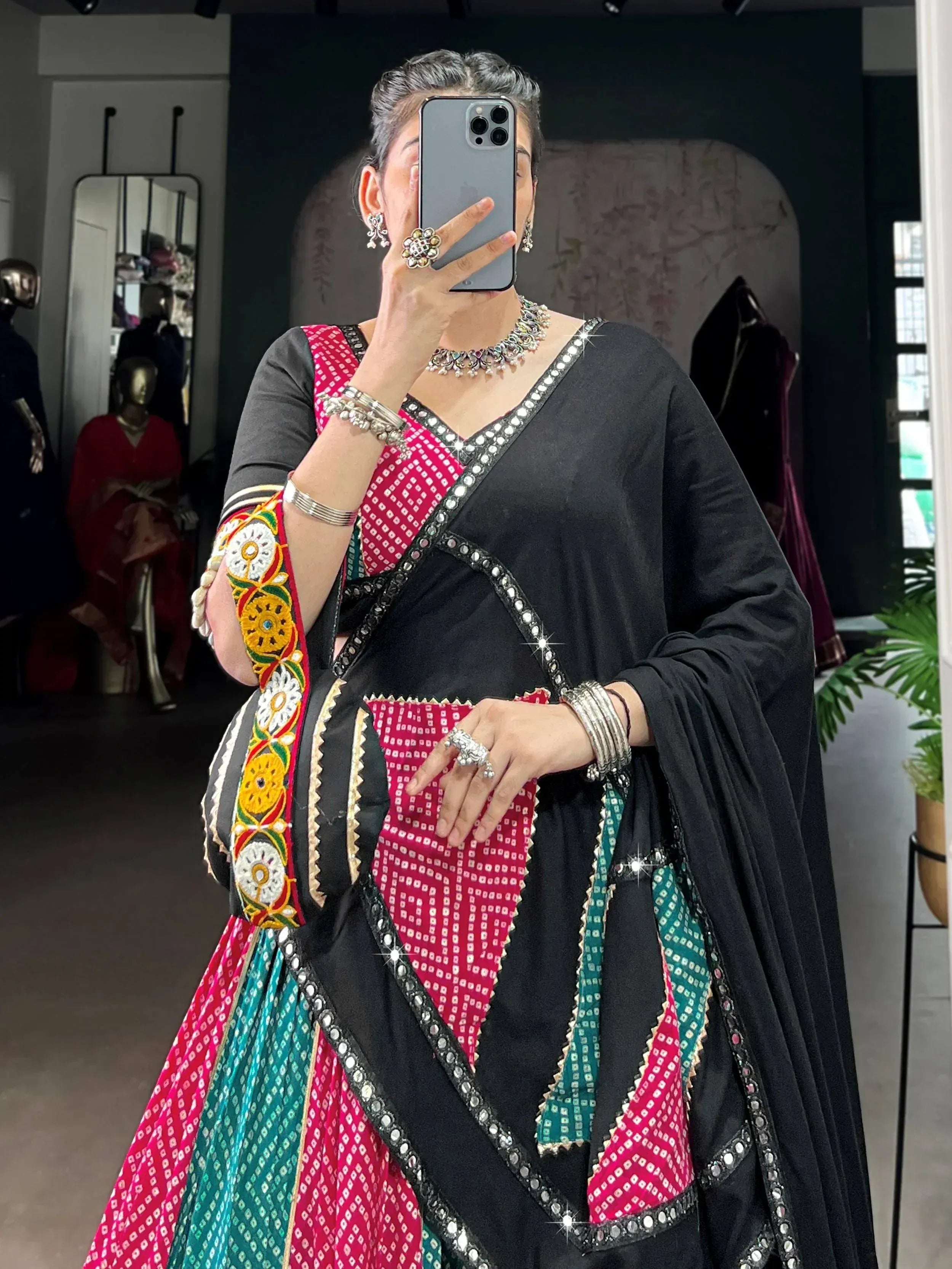 Black and pink embroidered ethnic lehenga choli with mirror work, traditional Indian wear