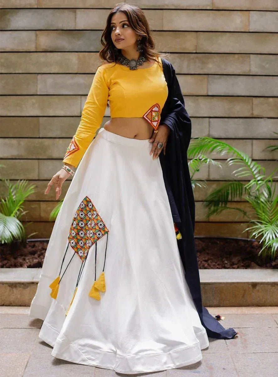 Yellow crop top with white lehenga featuring kite embroidery, paired with black dupatta for ethnic wear