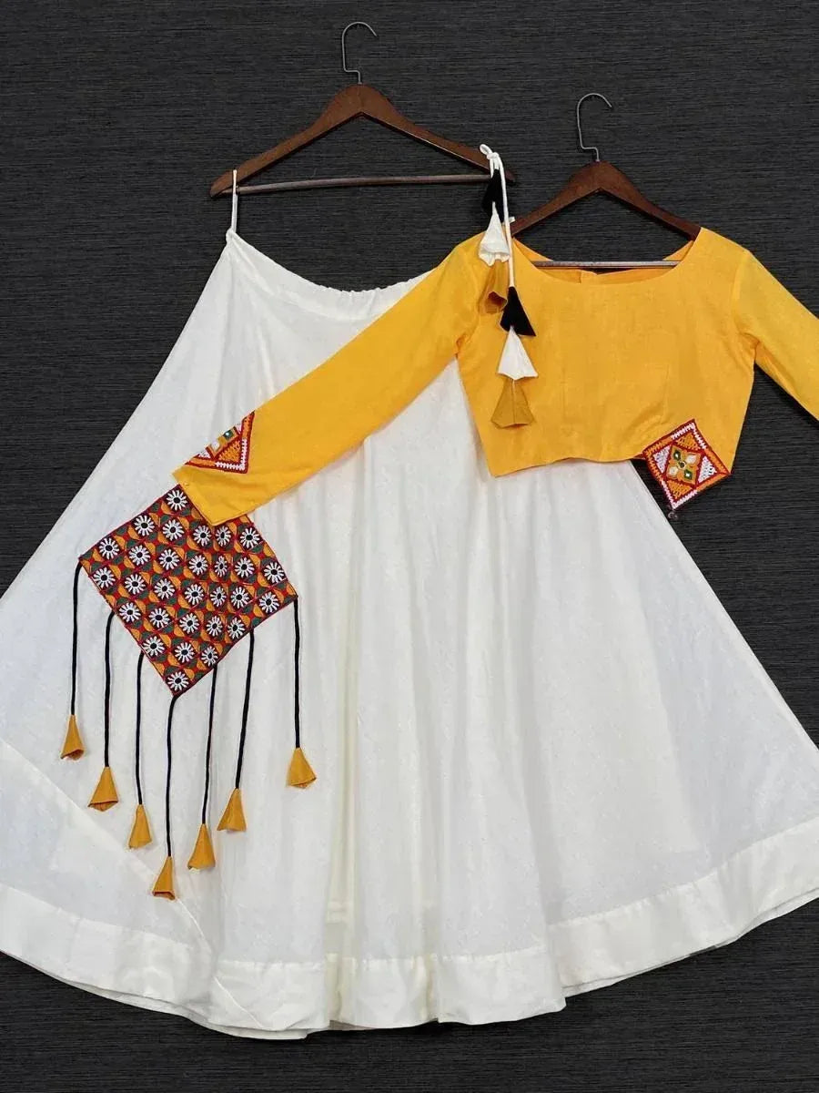 White flared skirt with yellow embroidered top, ethnic wear set with tassels and mirror work
