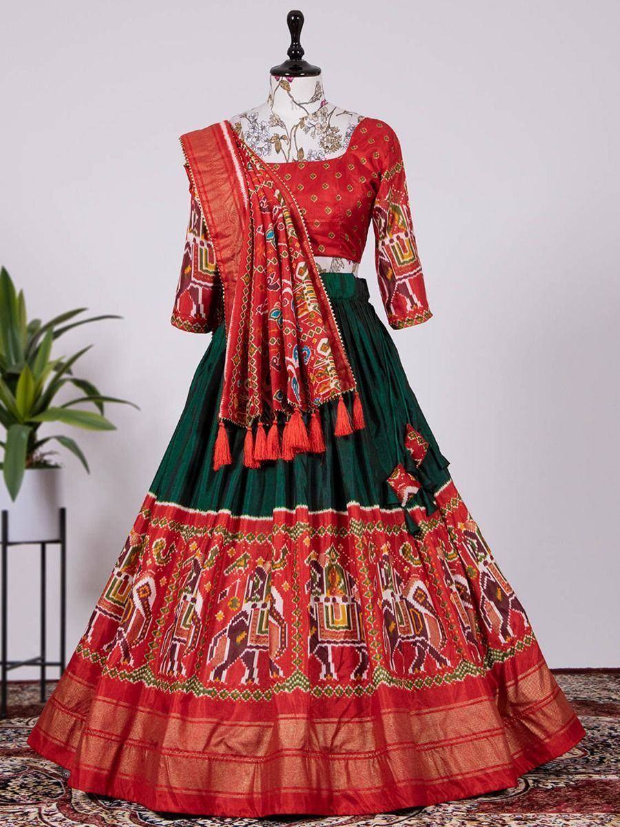 Red and green ethnic lehenga choli with elephant print and tassel dupatta, perfect for Indian weddings and festivals