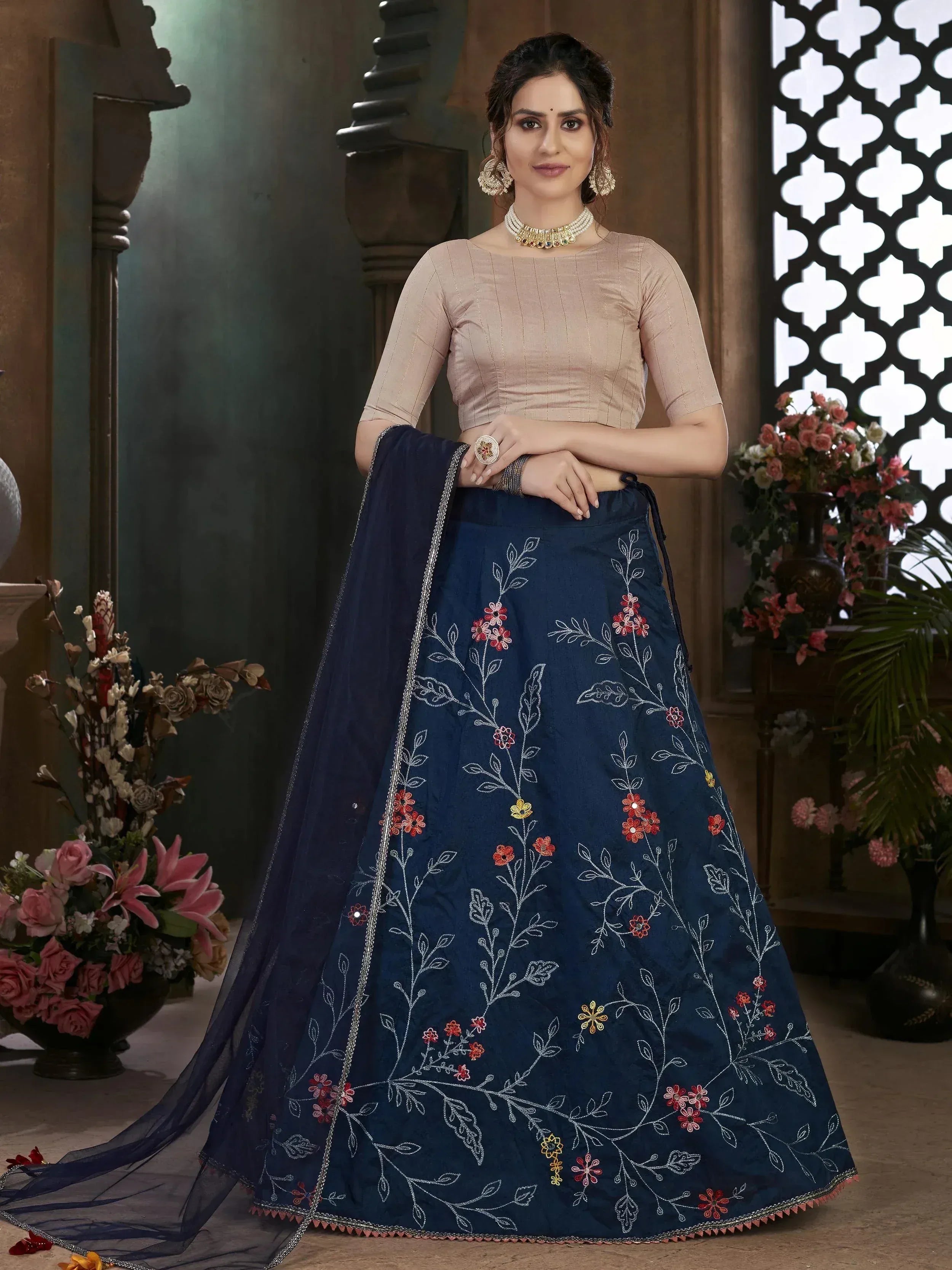 Navy blue embroidered lehenga choli with floral motifs, beige blouse, perfect for Indian ethnic wear occasions